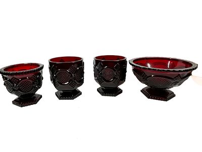 AVON CAPE COD RUBY RED GLASS GROUP. A group of Avon Cape Cod pattern ruby red pressed glass 