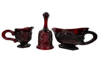TIARA RUBY RED GLASS TABLEWARES, 1979. A trio of ruby red pressed glass tablewares produced for 