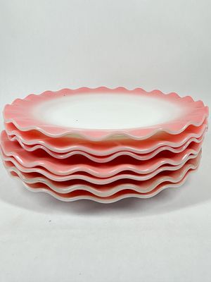 HAZEL ATLAS RUFFLED PLATES. A set of milk glass plates with ruffled rims and a fired-on pink 