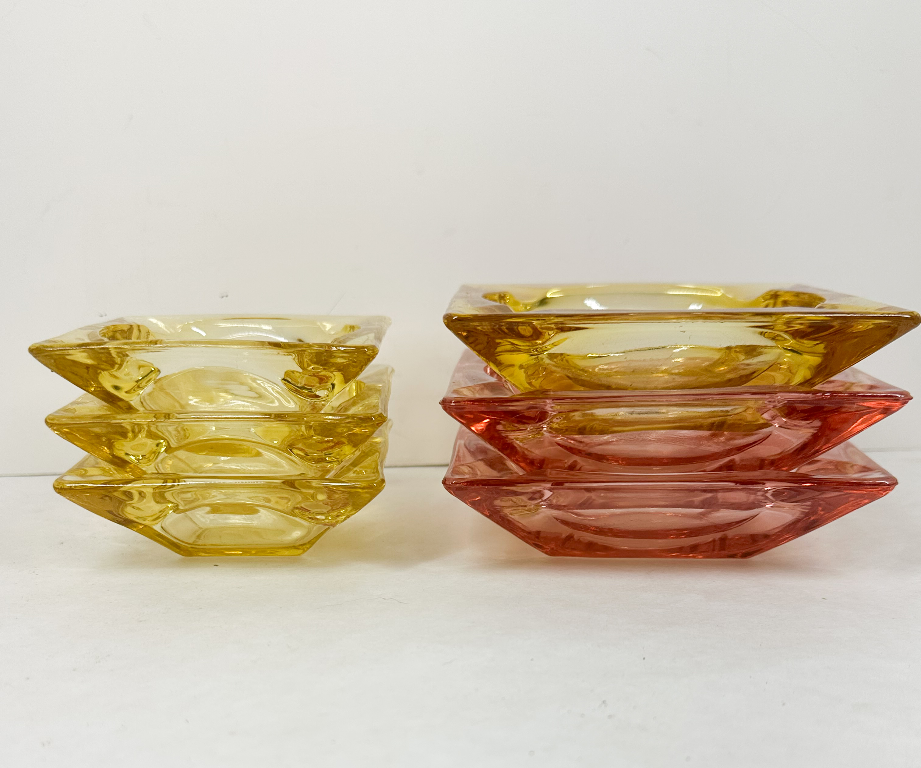 SIX MID-CENTURY PRESSED GLASS ASHTRAYS