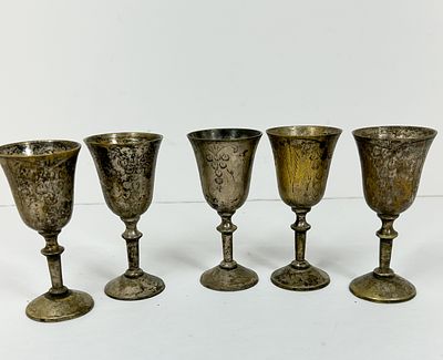 SET OF INDIAN SILVER-PLATED GOBLETS. A set of five silver-plated brass goblets featuring 
