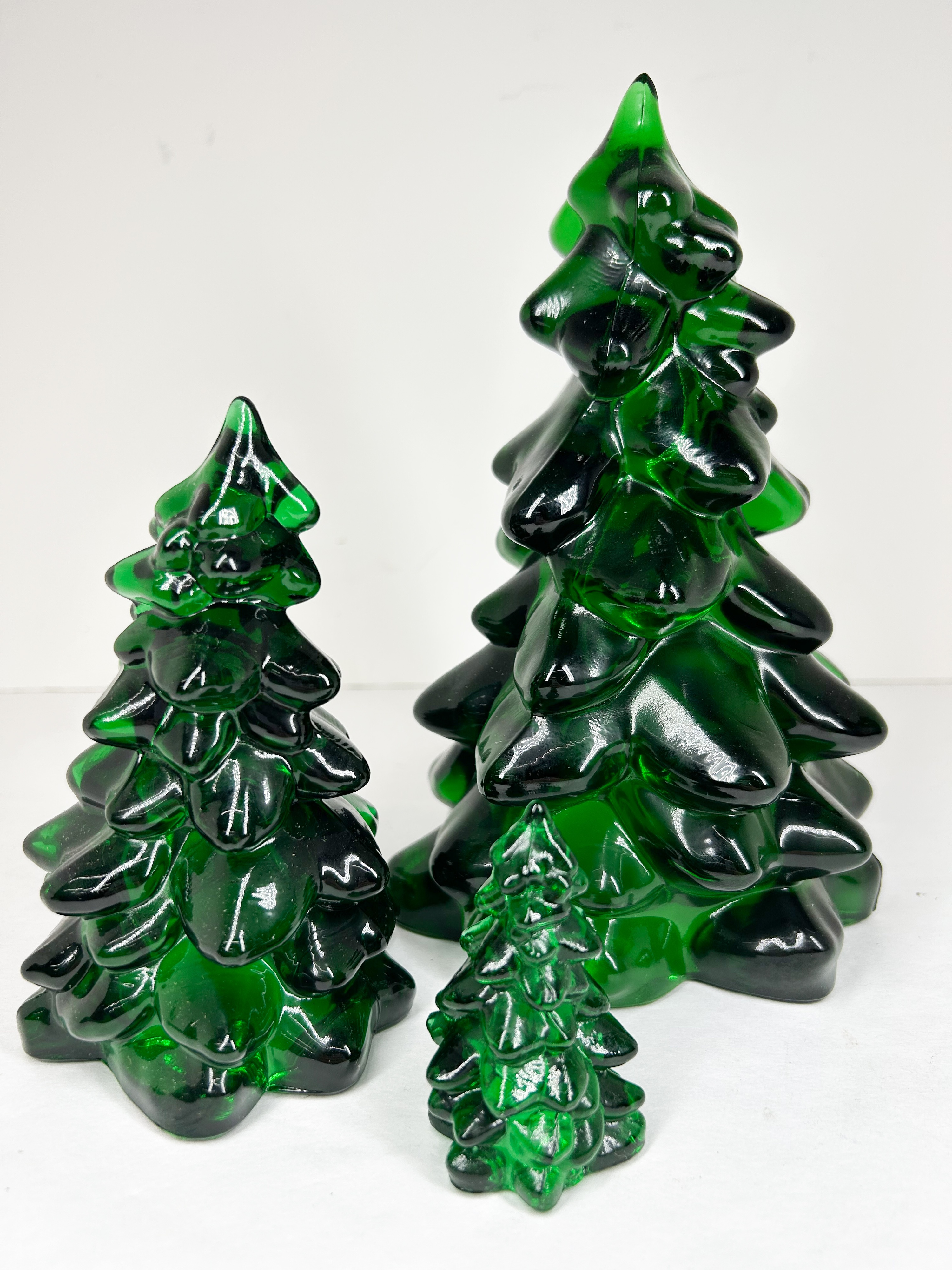 MOSSER TRIO OF MOLDED GREEN GLASS TREES