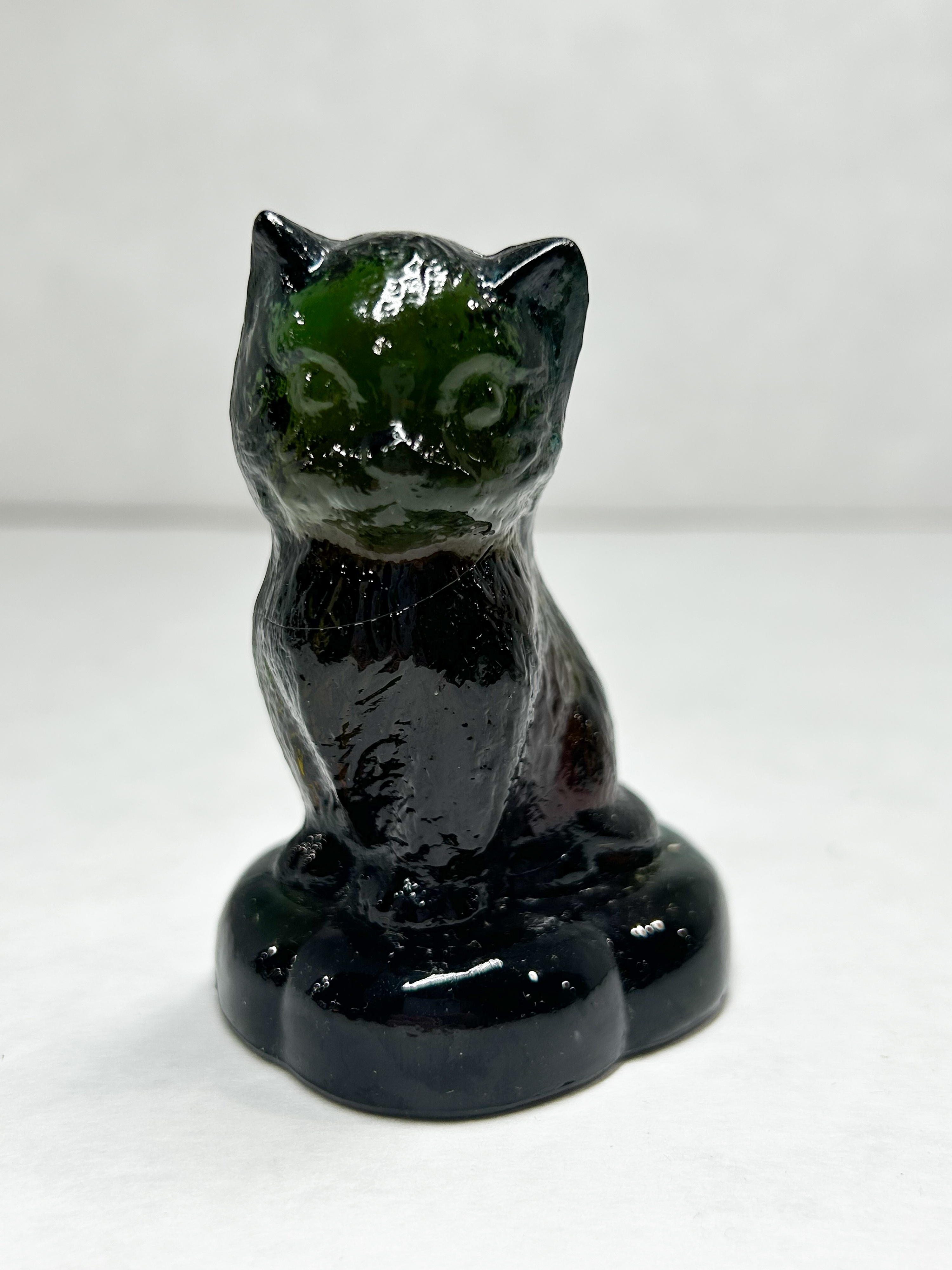 BOYD BLACK SITTING KITTEN ON PILLOW