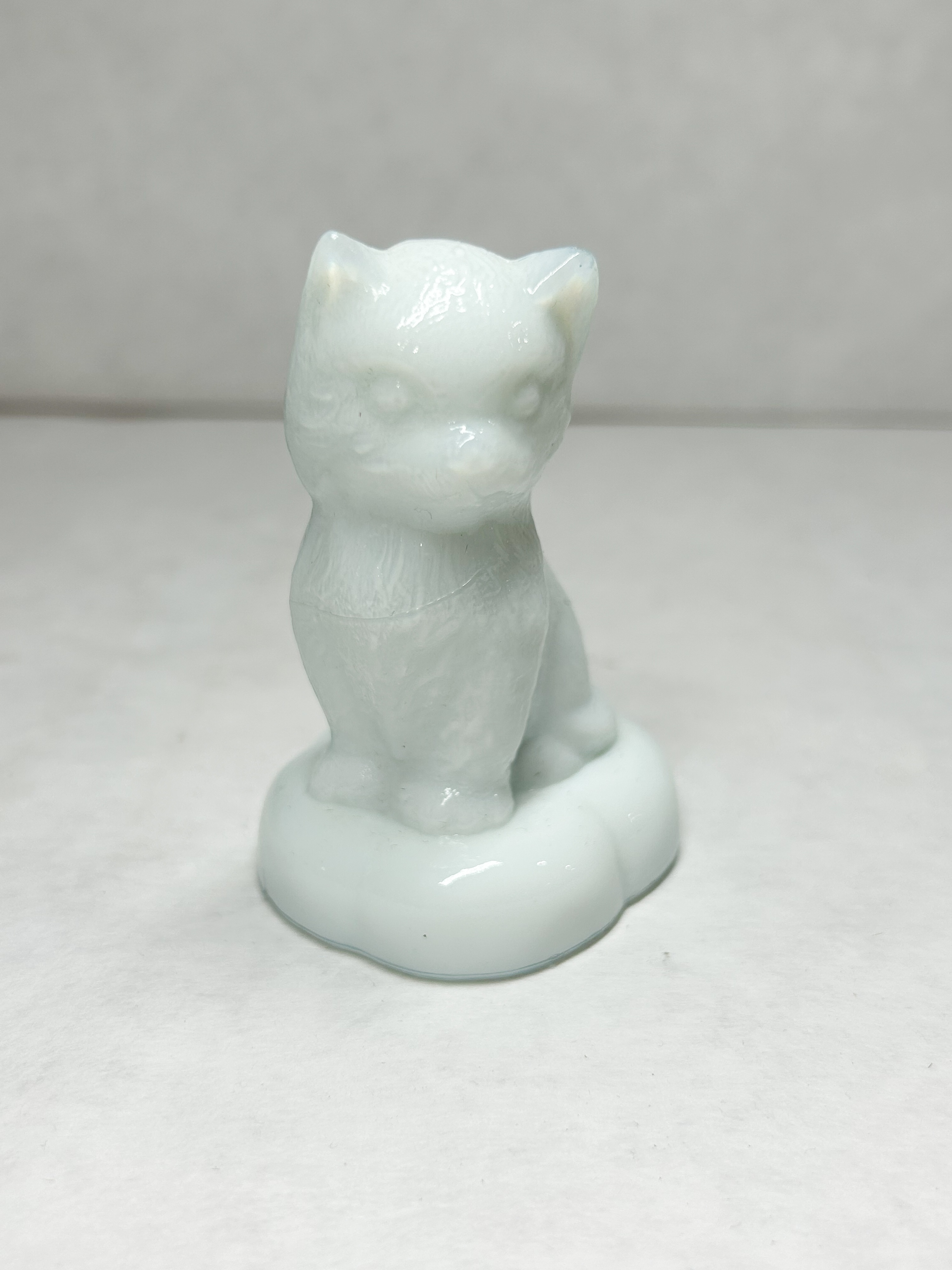 BOYD WHITE SITTING KITTEN ON PILLOW