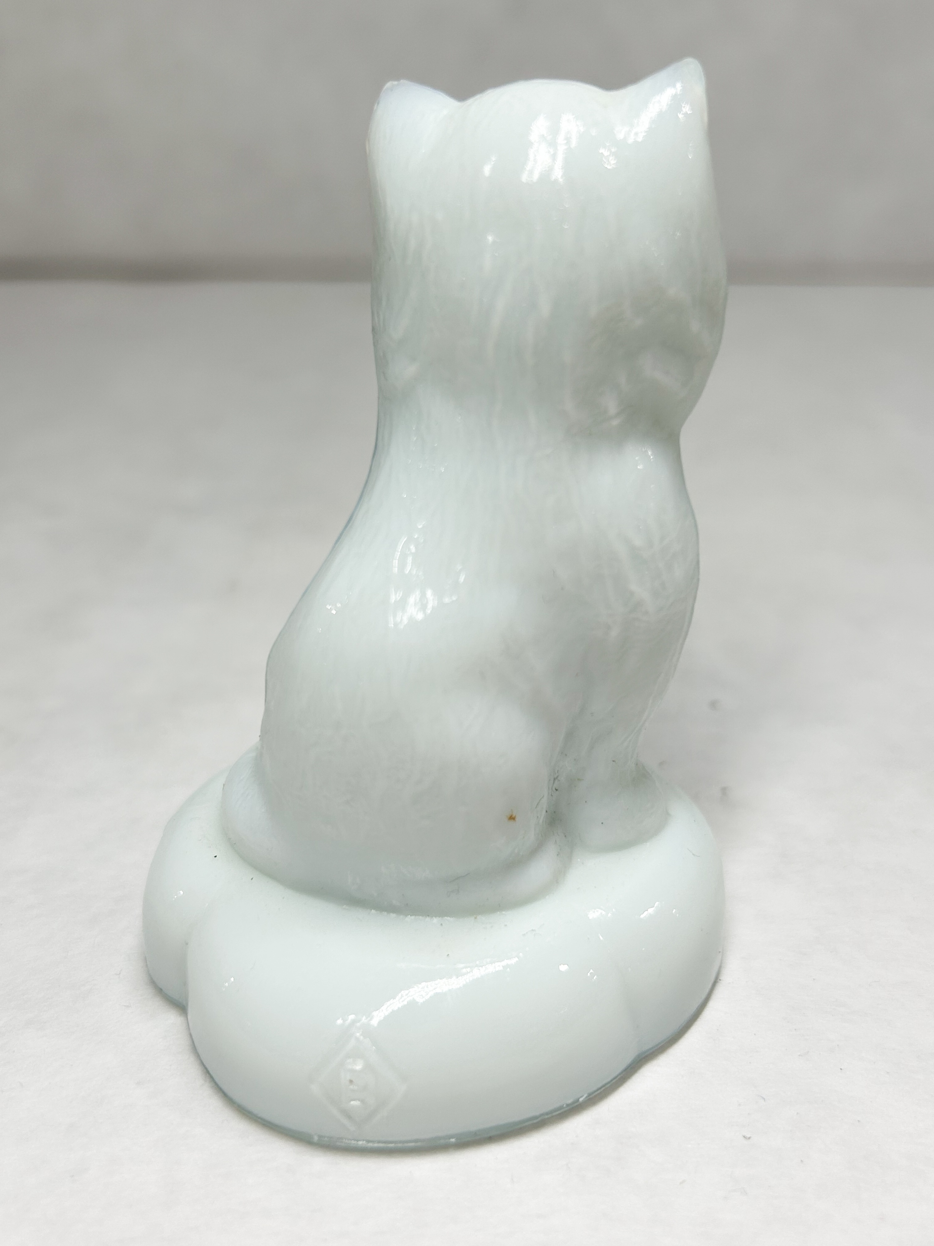 BOYD WHITE SITTING KITTEN ON PILLOW