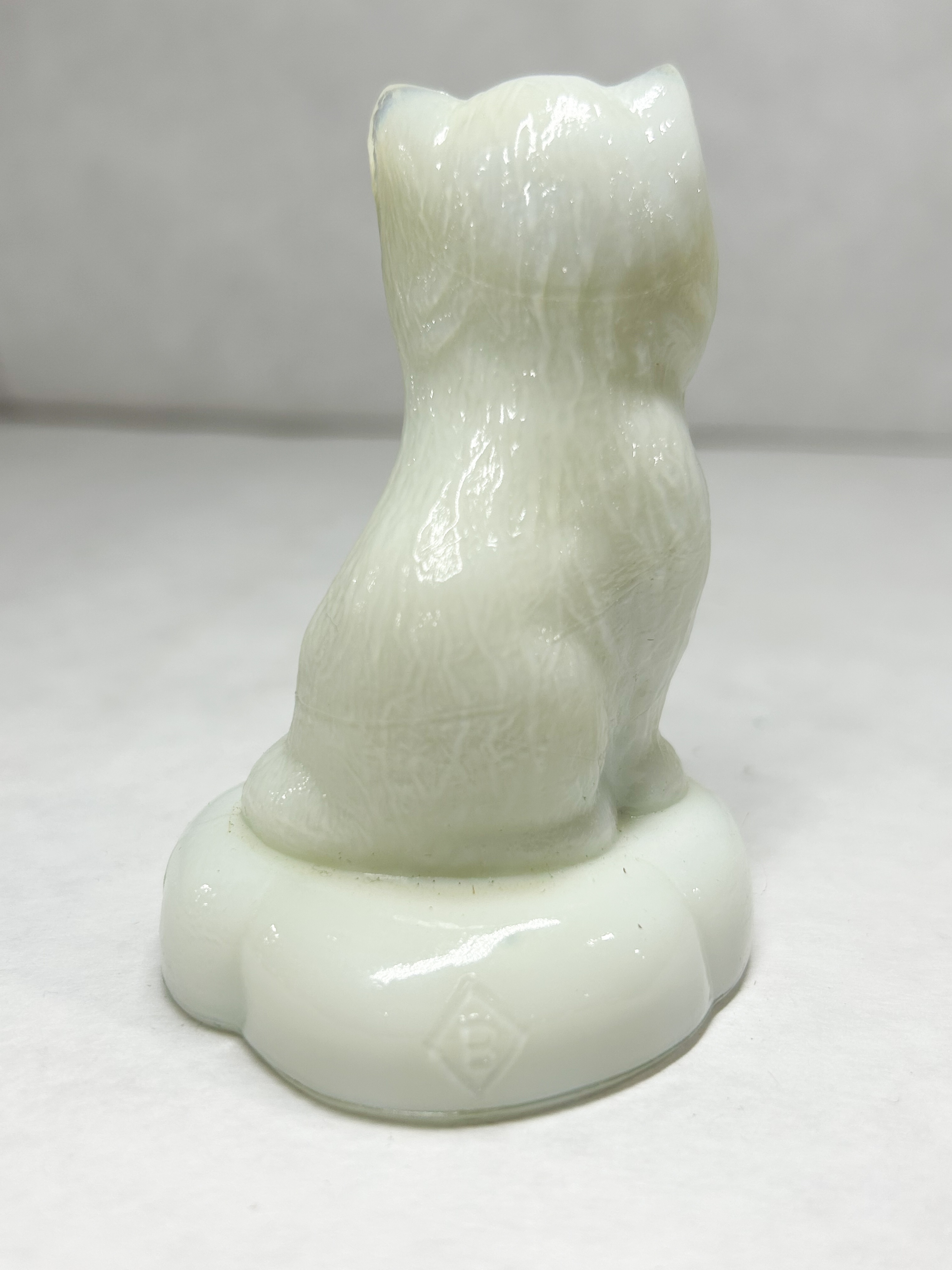 BOYD WHITE SITTING KITTEN ON PILLOW