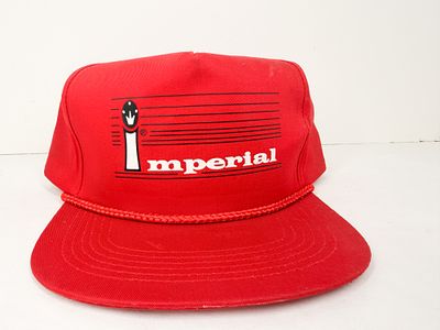 IMPERIAL VINTAGE RED SNAPBACK CAP. A red synthetic fabric trucker-style hat featuring a braided 