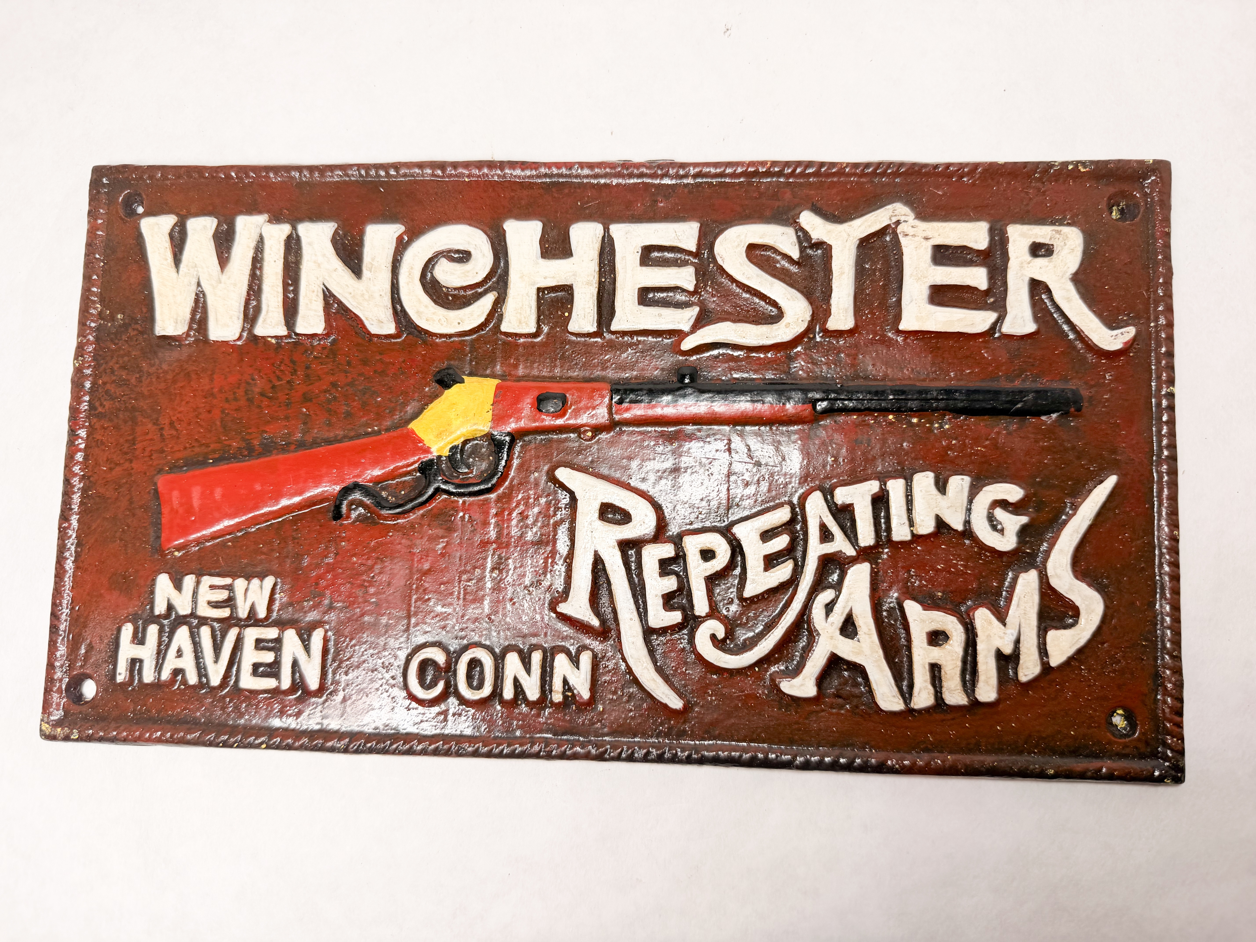 WINCHESTER CAST IRON ADVERTISING SIGN