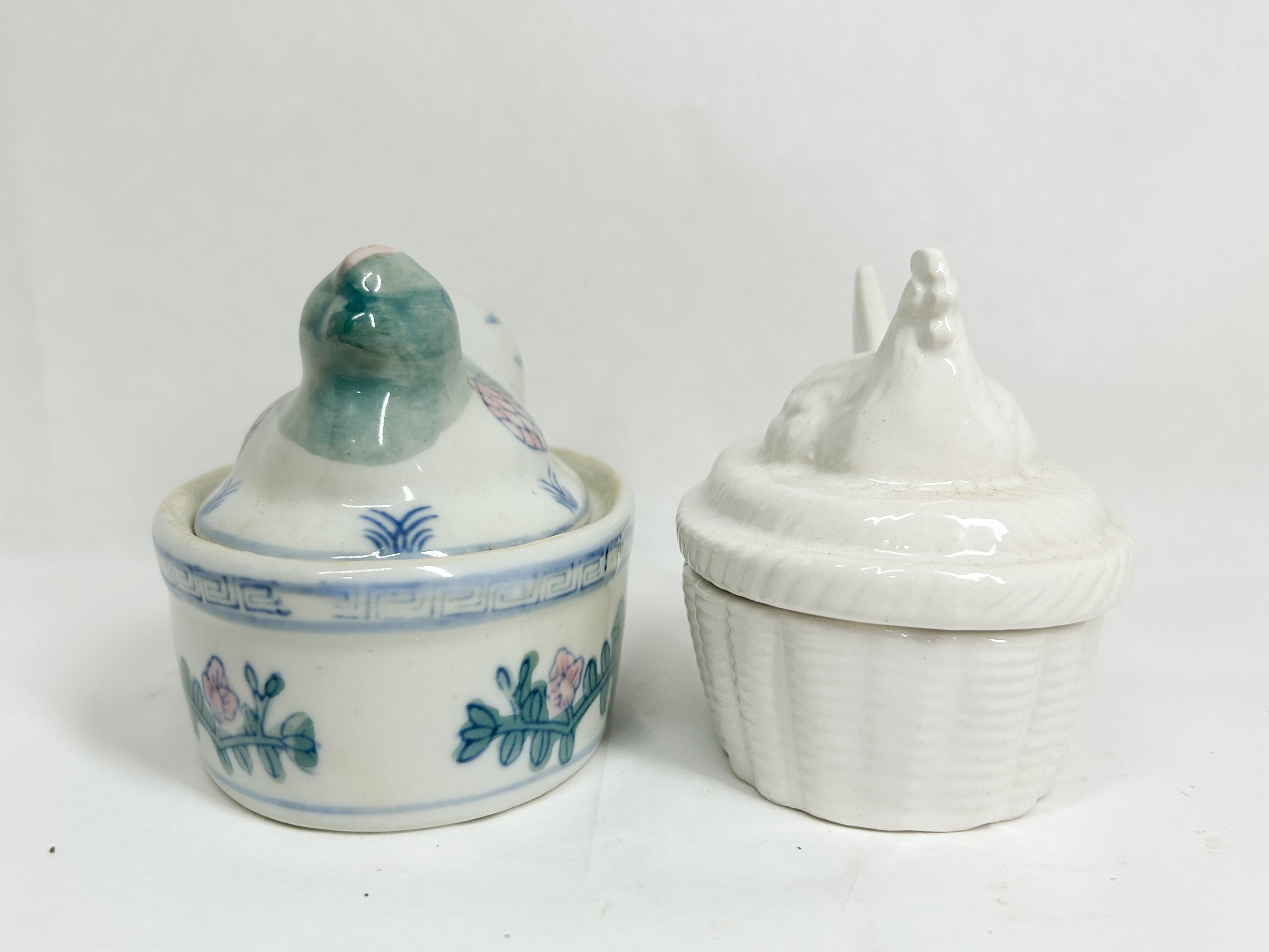 TWO CERAMIC HEN ON NEST TRINKET BOXES