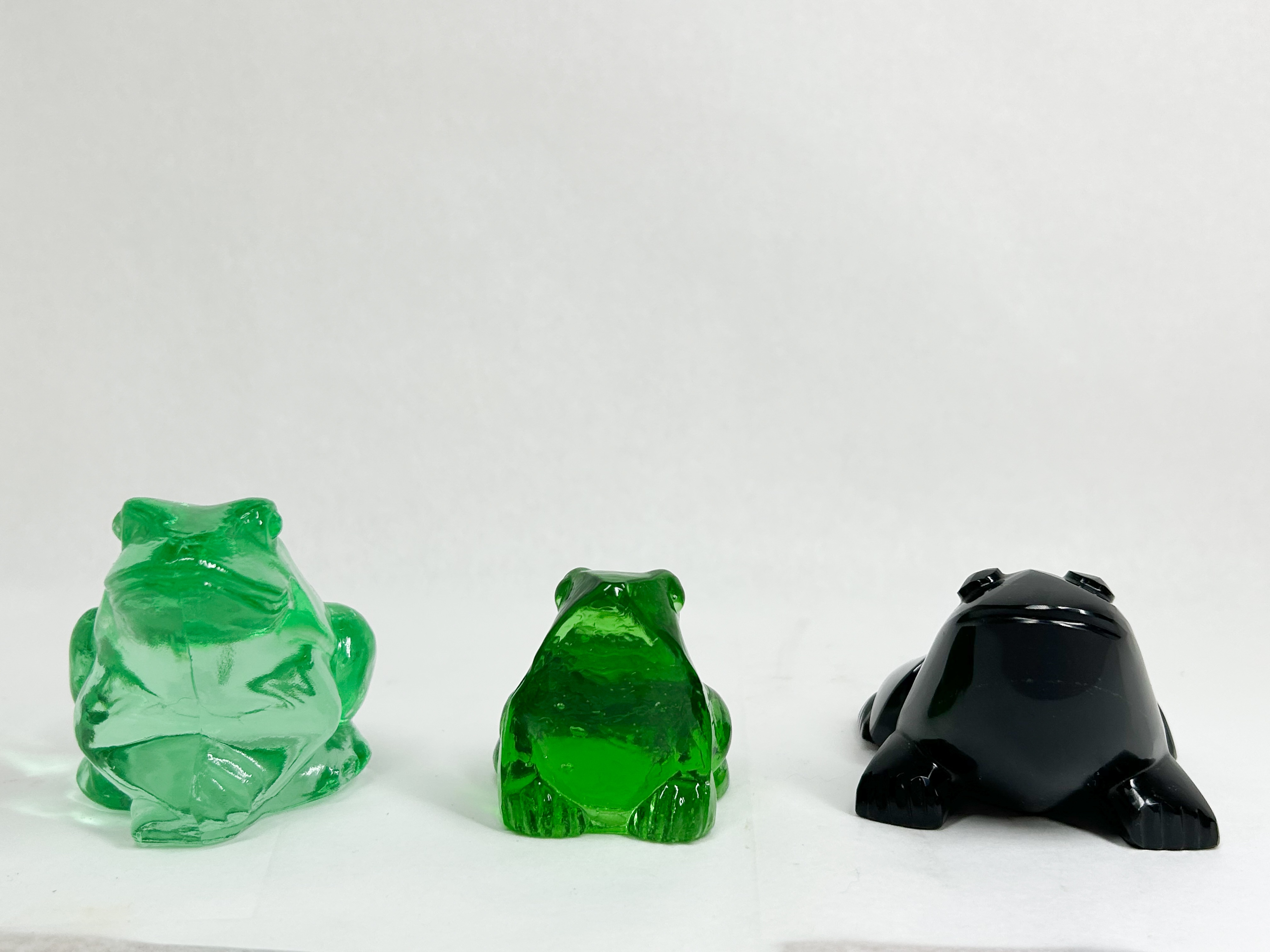 THREE GLASS AND STONE FROG FIGURINES