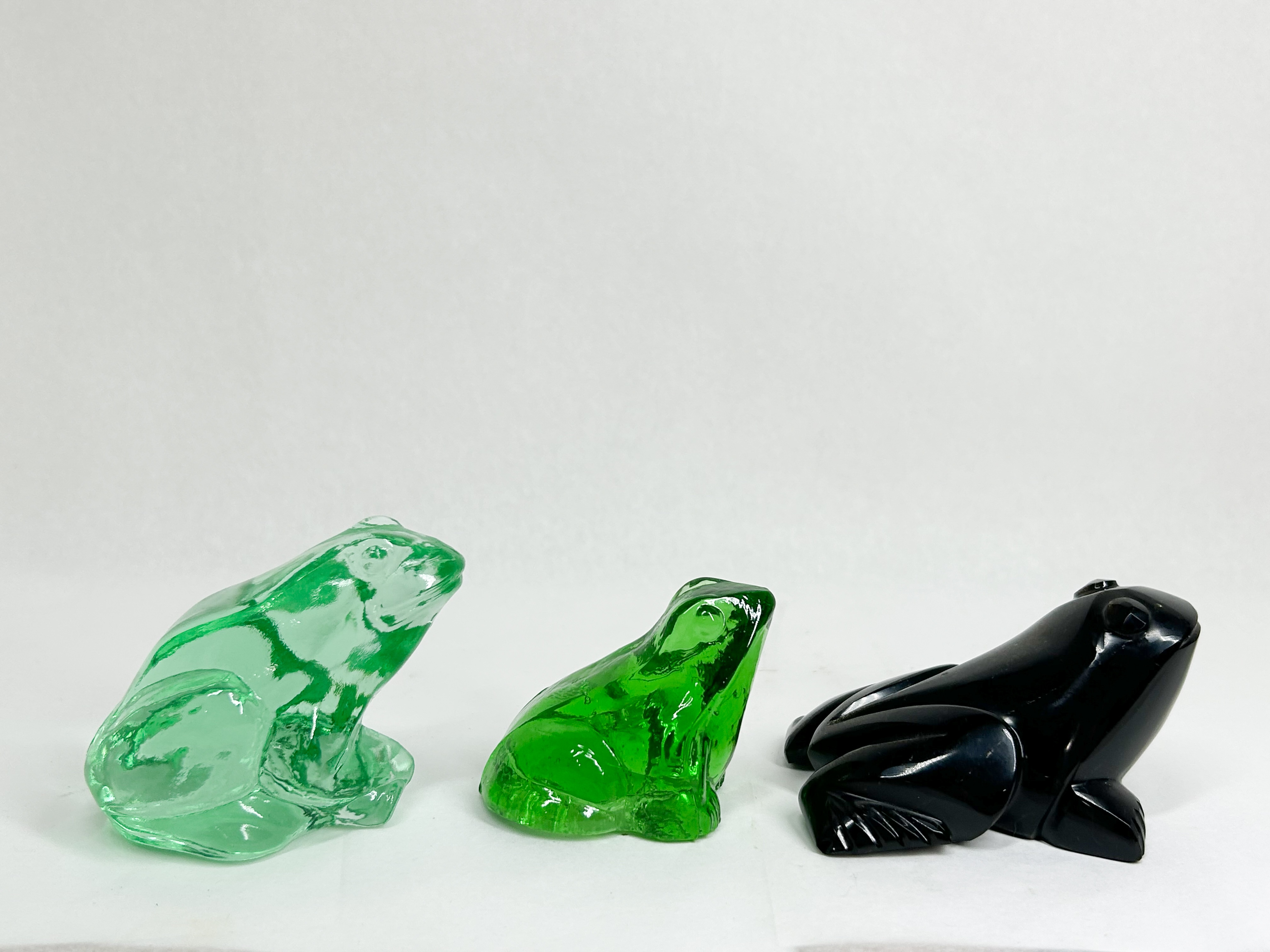 THREE GLASS AND STONE FROG FIGURINES