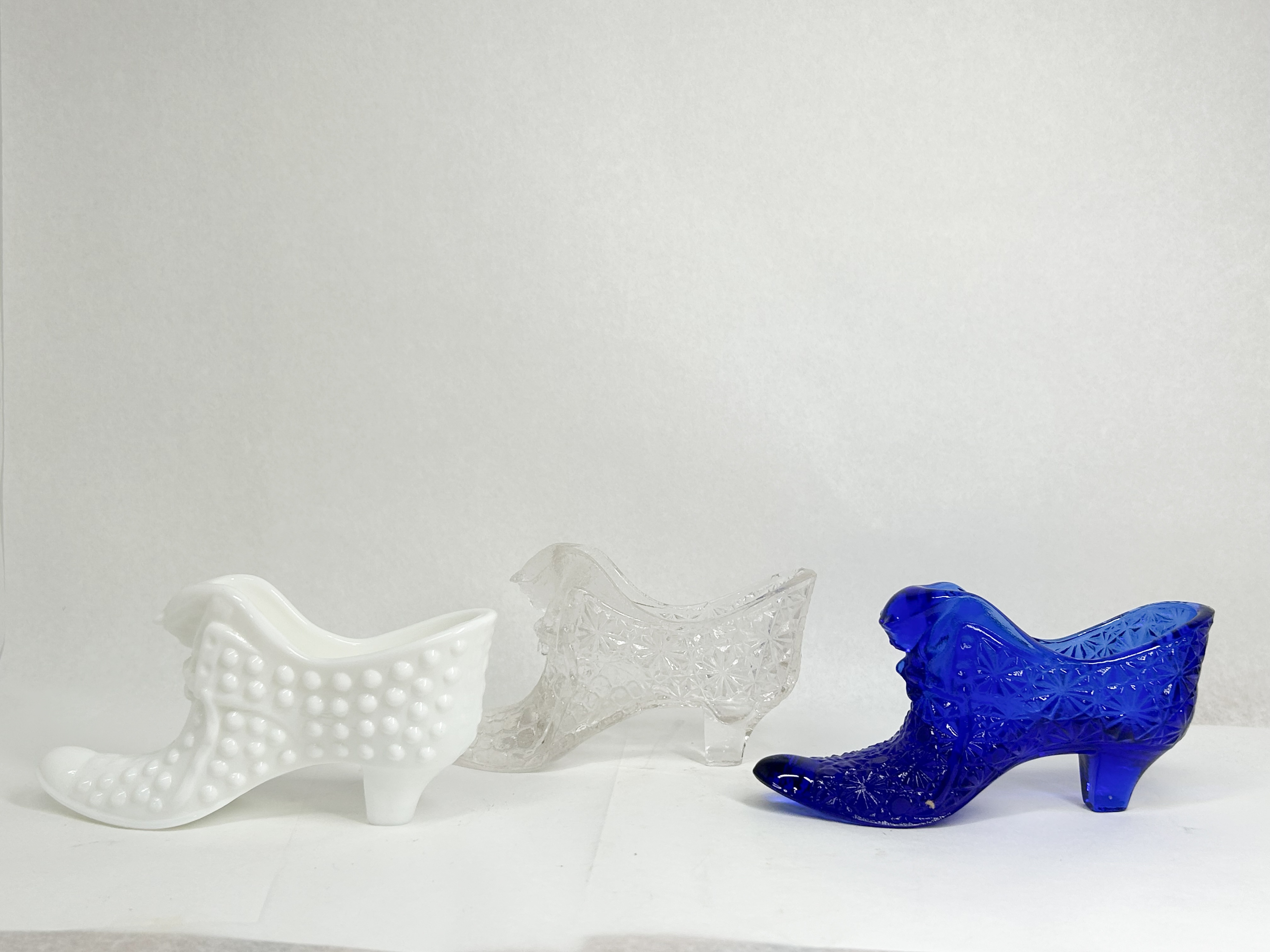 TRIO OF GLASS CAT HEAD SLIPPERS