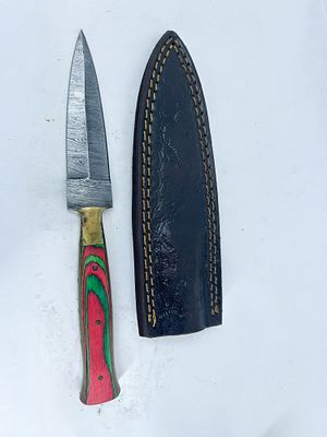 DAMASCUS STEEL AND PAKKAWOOD DAGGER. A double-edged spear point dagger featuring a 