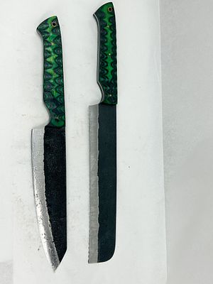 DAMASCUS TWO CUSTOM FIXED BLADE FILE KNIVES. A pair of custom-made full-tang fixed blade knives 