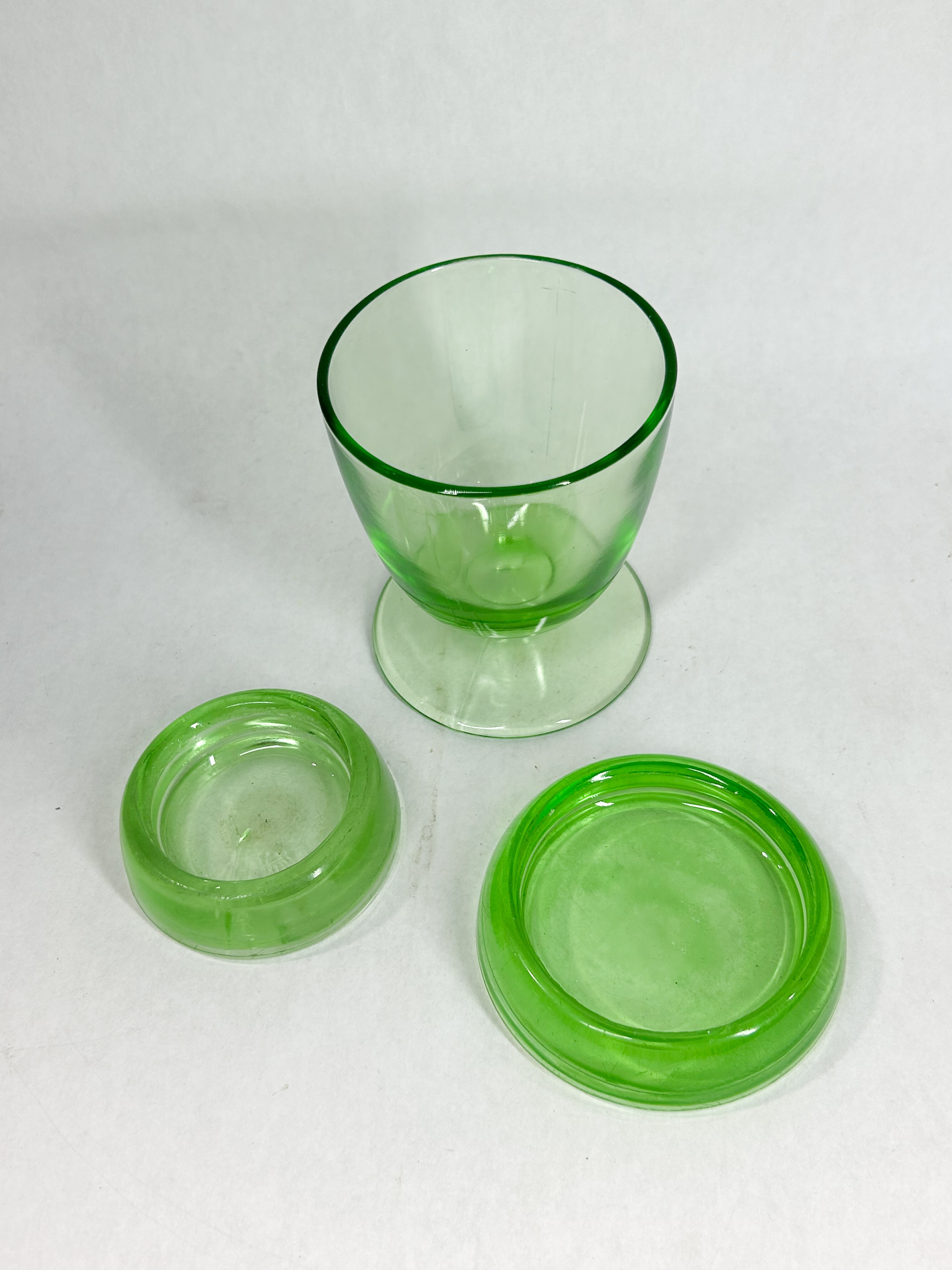 HEISEY URANIUM GLASS CUP AND CASTERS