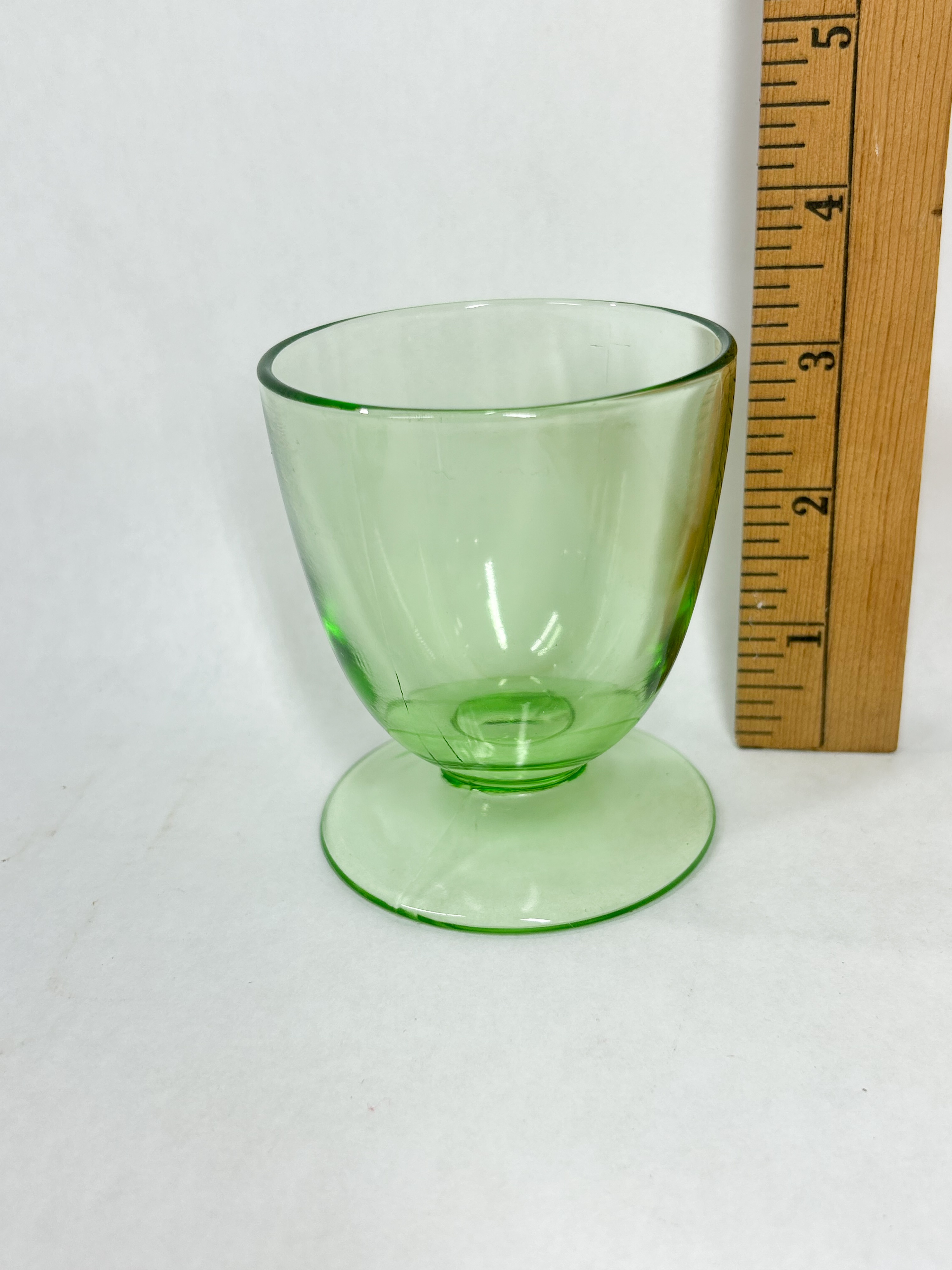HEISEY URANIUM GLASS CUP AND CASTERS