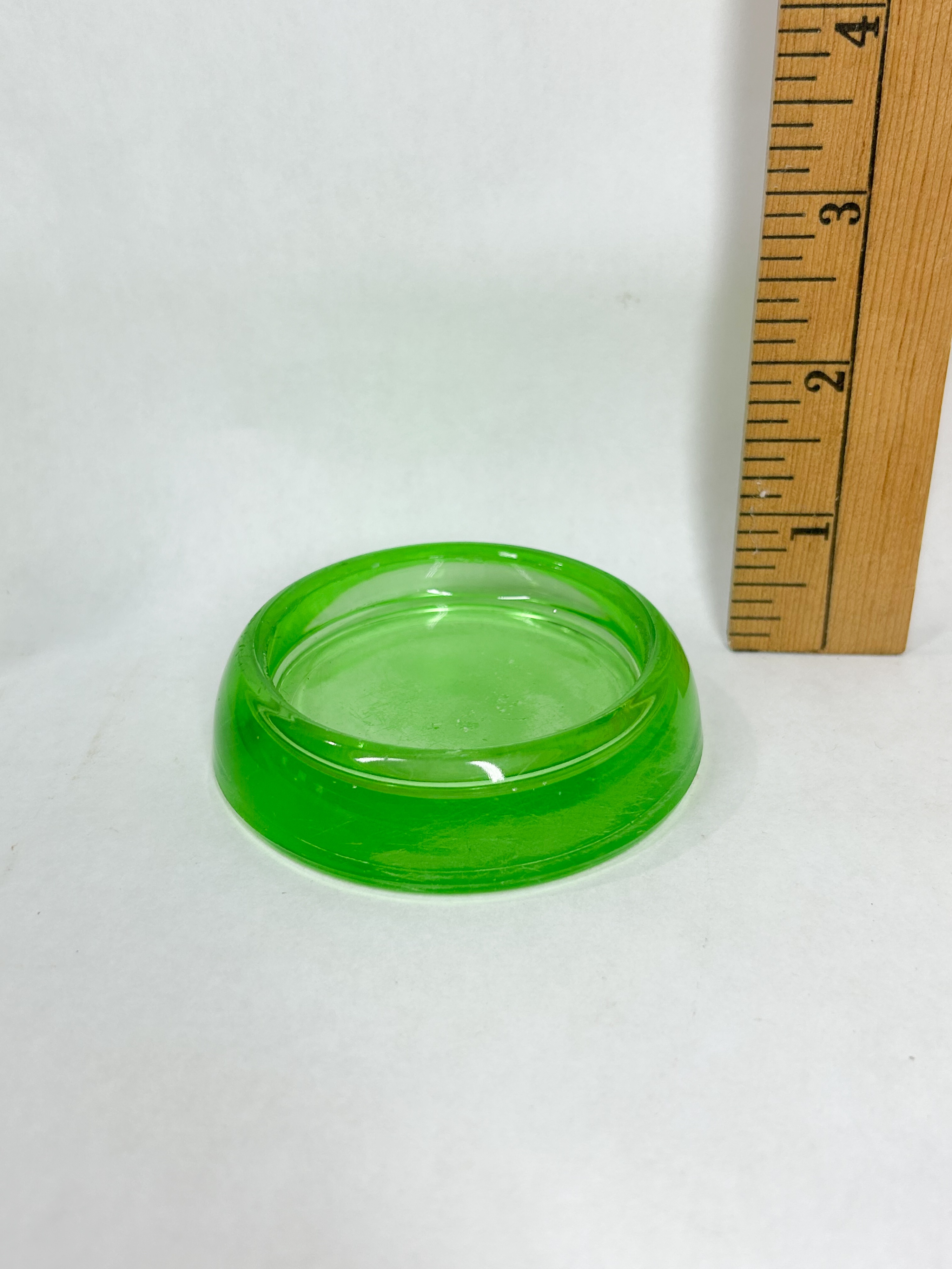 HEISEY URANIUM GLASS CUP AND CASTERS