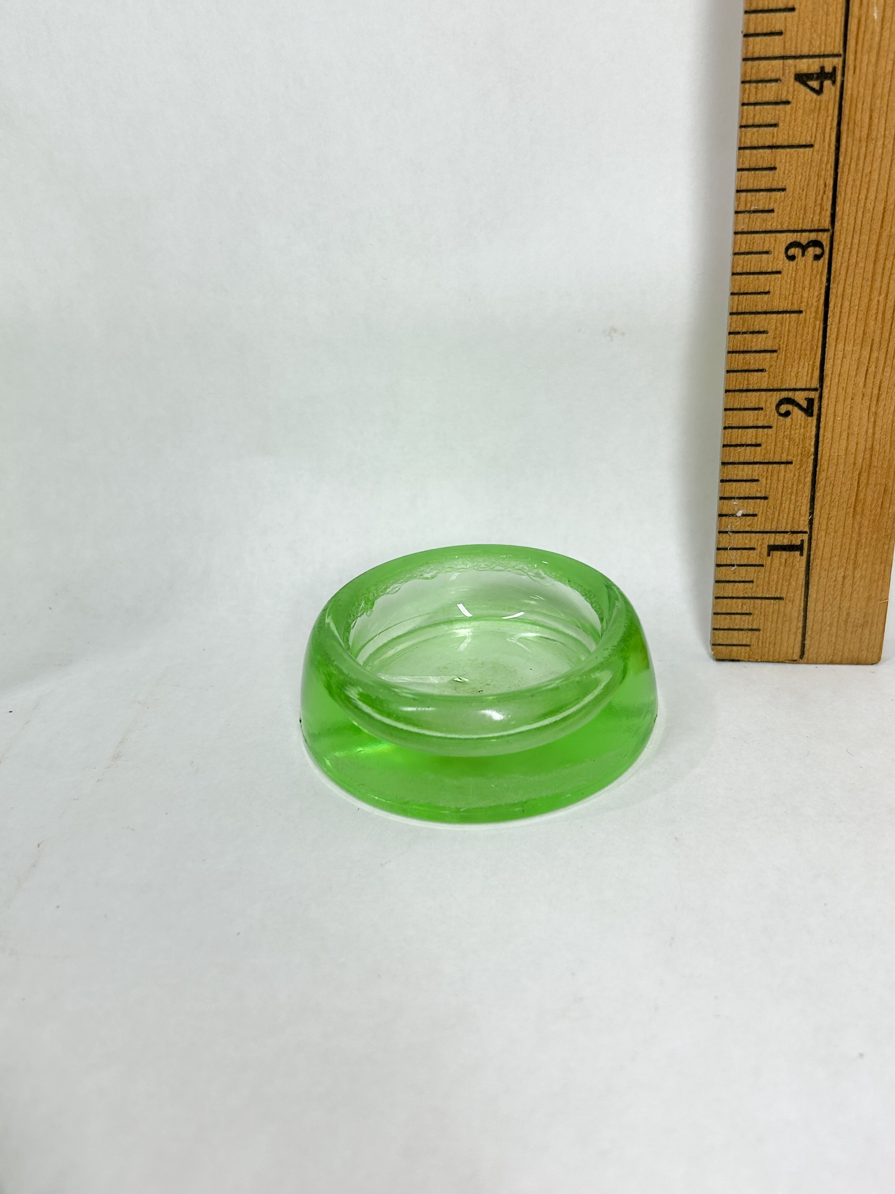 HEISEY URANIUM GLASS CUP AND CASTERS