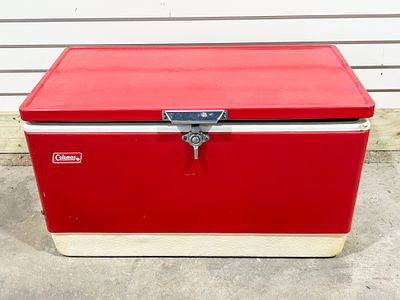 COLEMAN STEEL-BELTED METAL COOLER. Vintage red steel-belted chest cooler manufactured by 