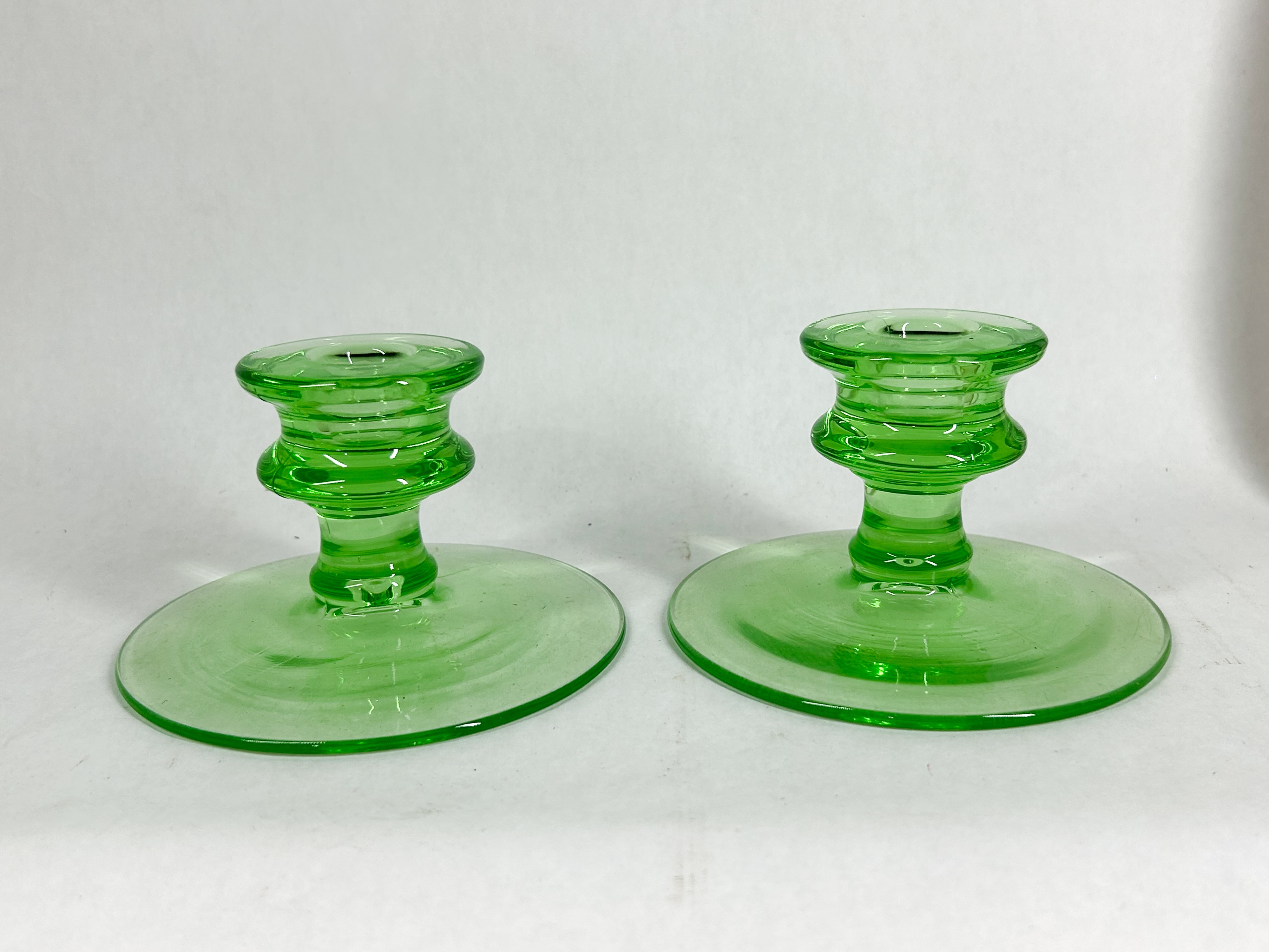 PAIR OF URANIUM GLASS CANDLESTICK HOLDERS