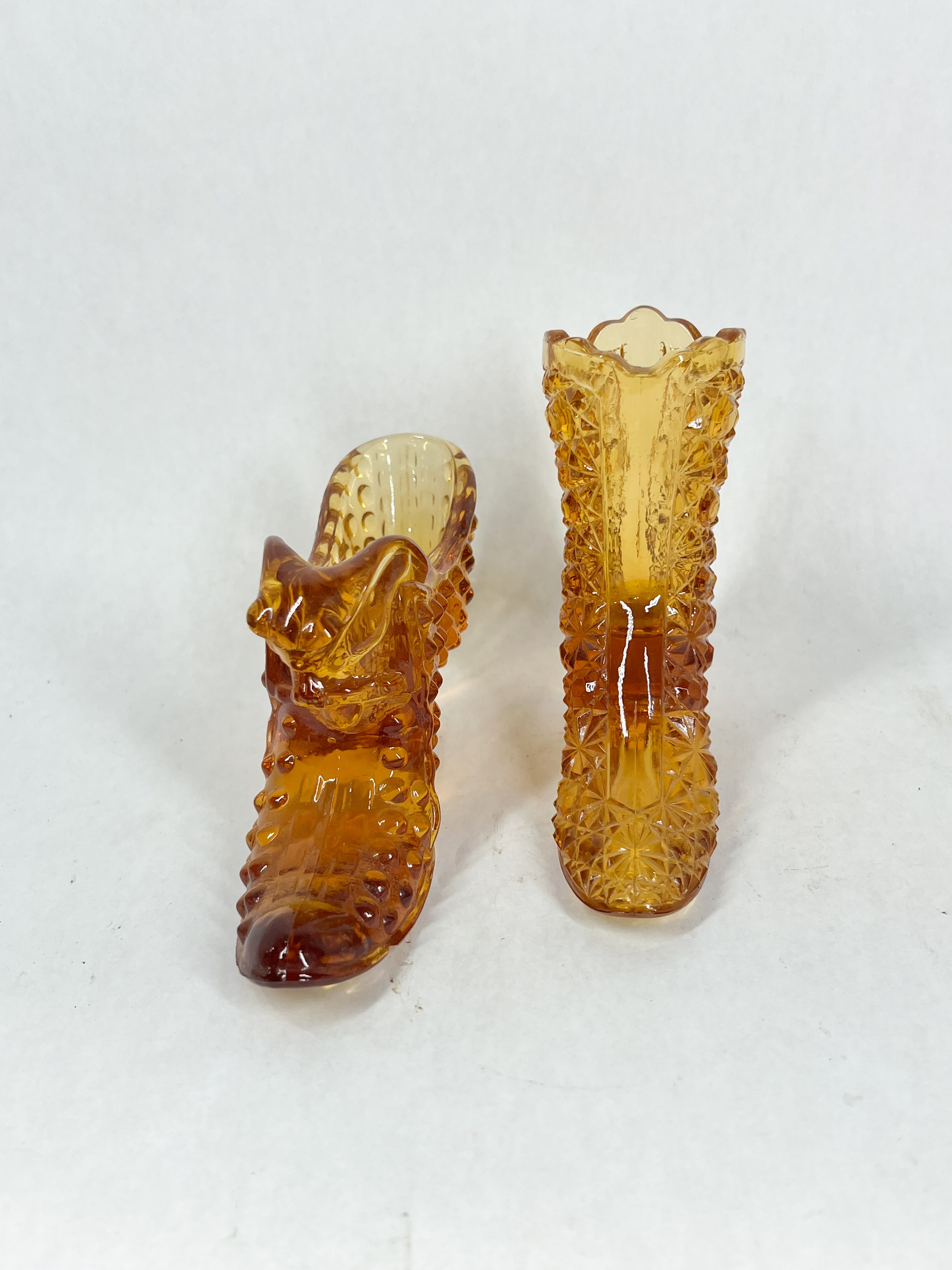 TWO AMBER GLASS SHOES