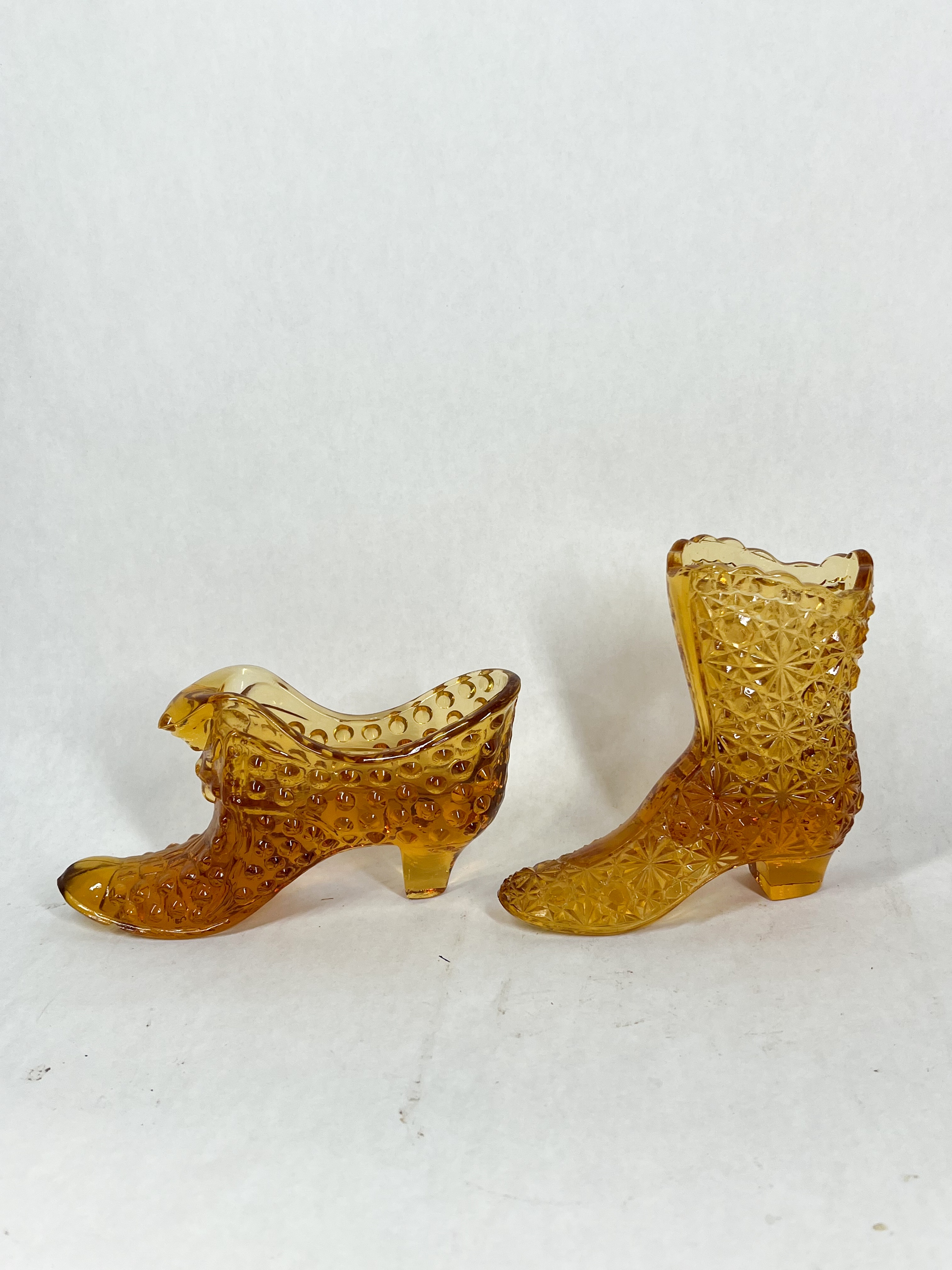 TWO AMBER GLASS SHOES