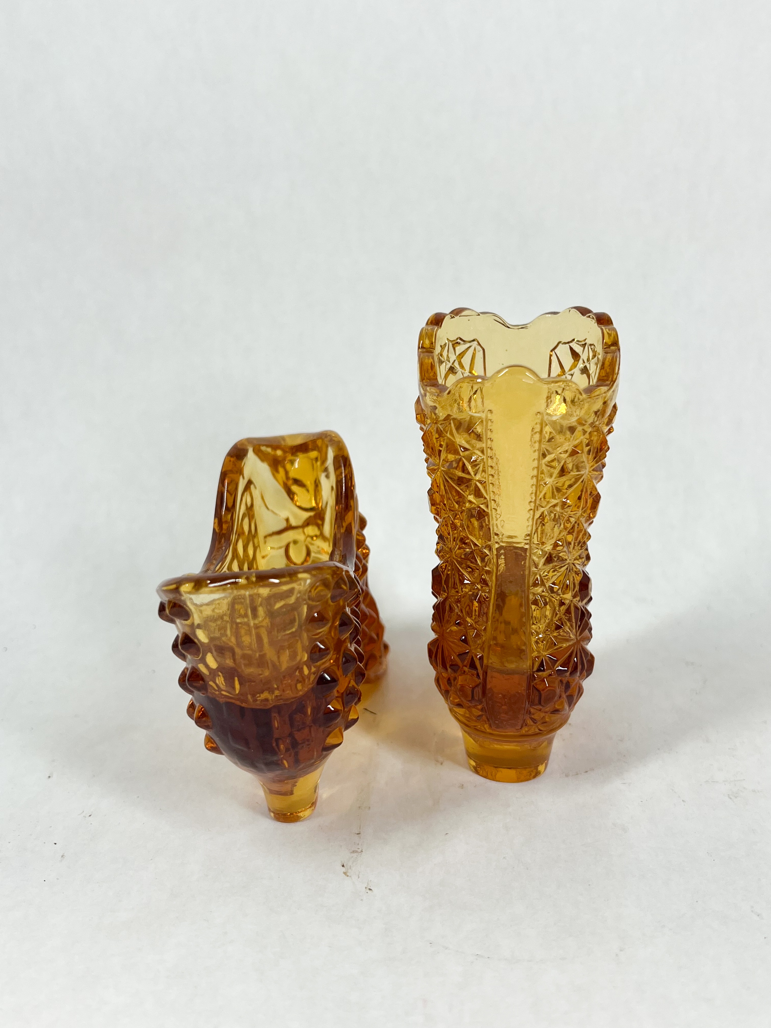 TWO AMBER GLASS SHOES