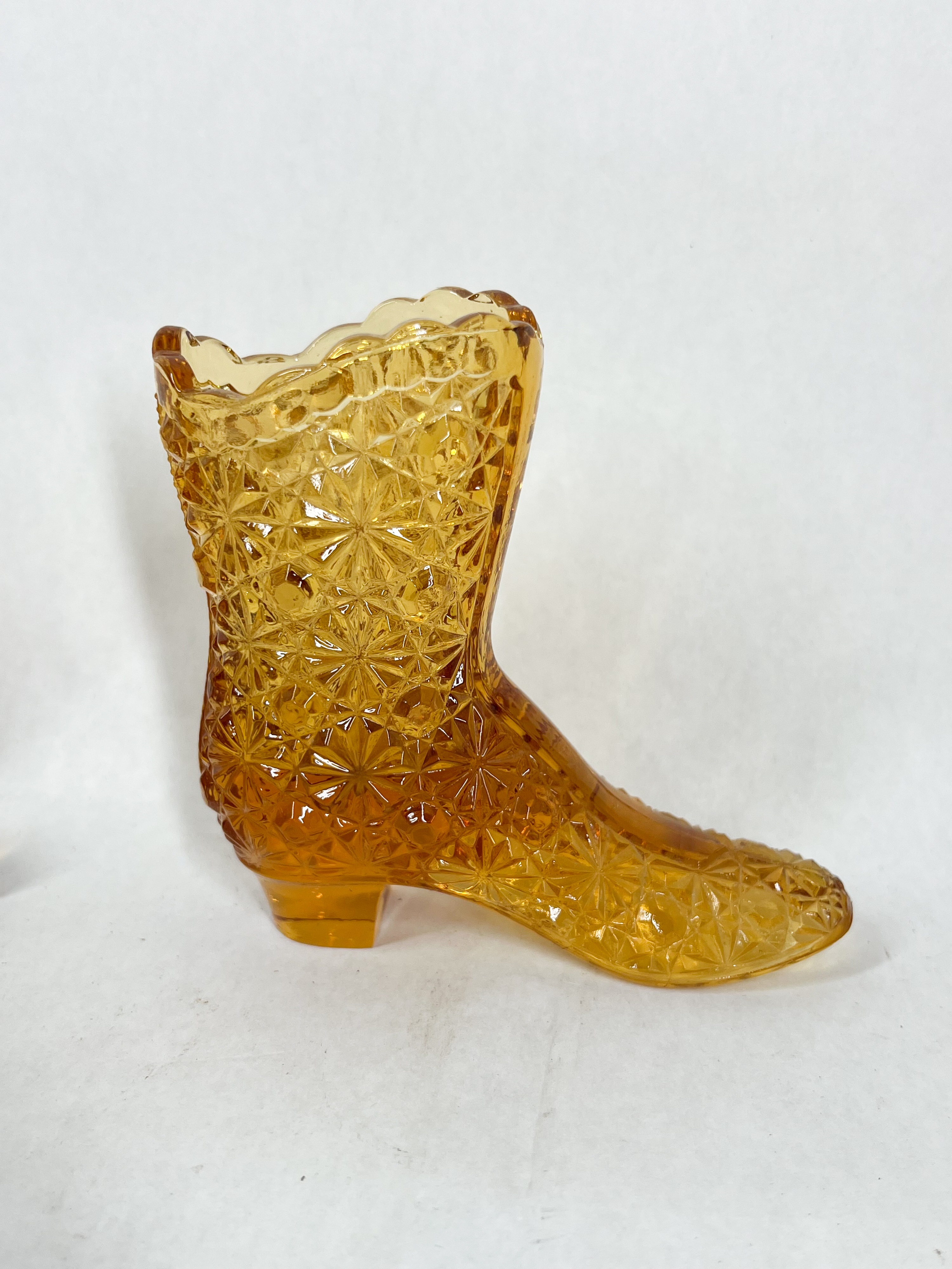 TWO AMBER GLASS SHOES