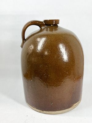 TWO AMERICAN GLAZED STONEWARE JUGS. Pair of antique American stoneware jugs featuring an ovoid 