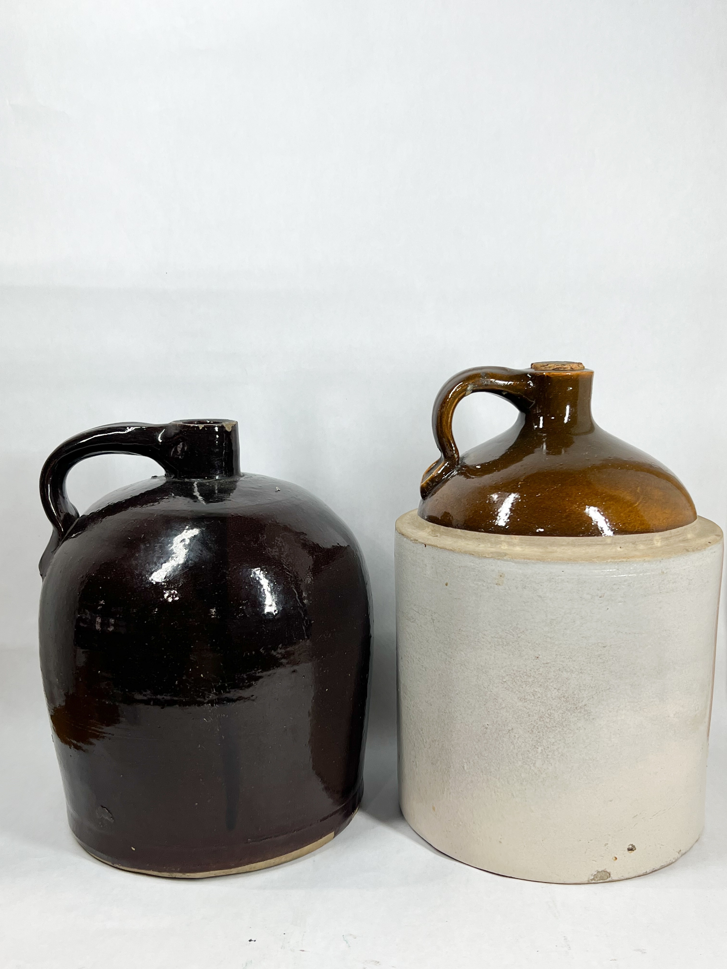 TWO ANTIQUE STONEWARE WHISKEY JUGS