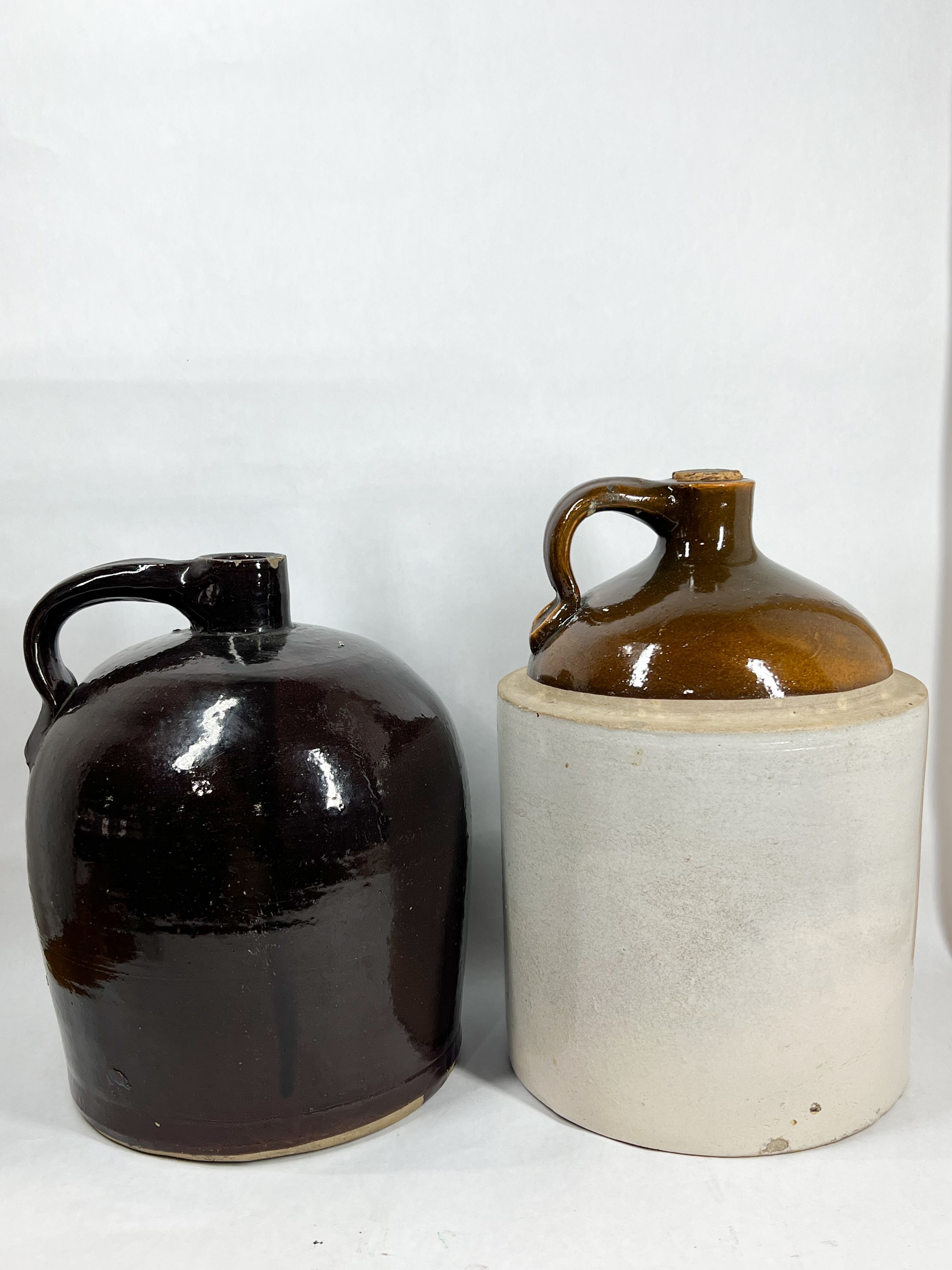TWO ANTIQUE STONEWARE WHISKEY JUGS