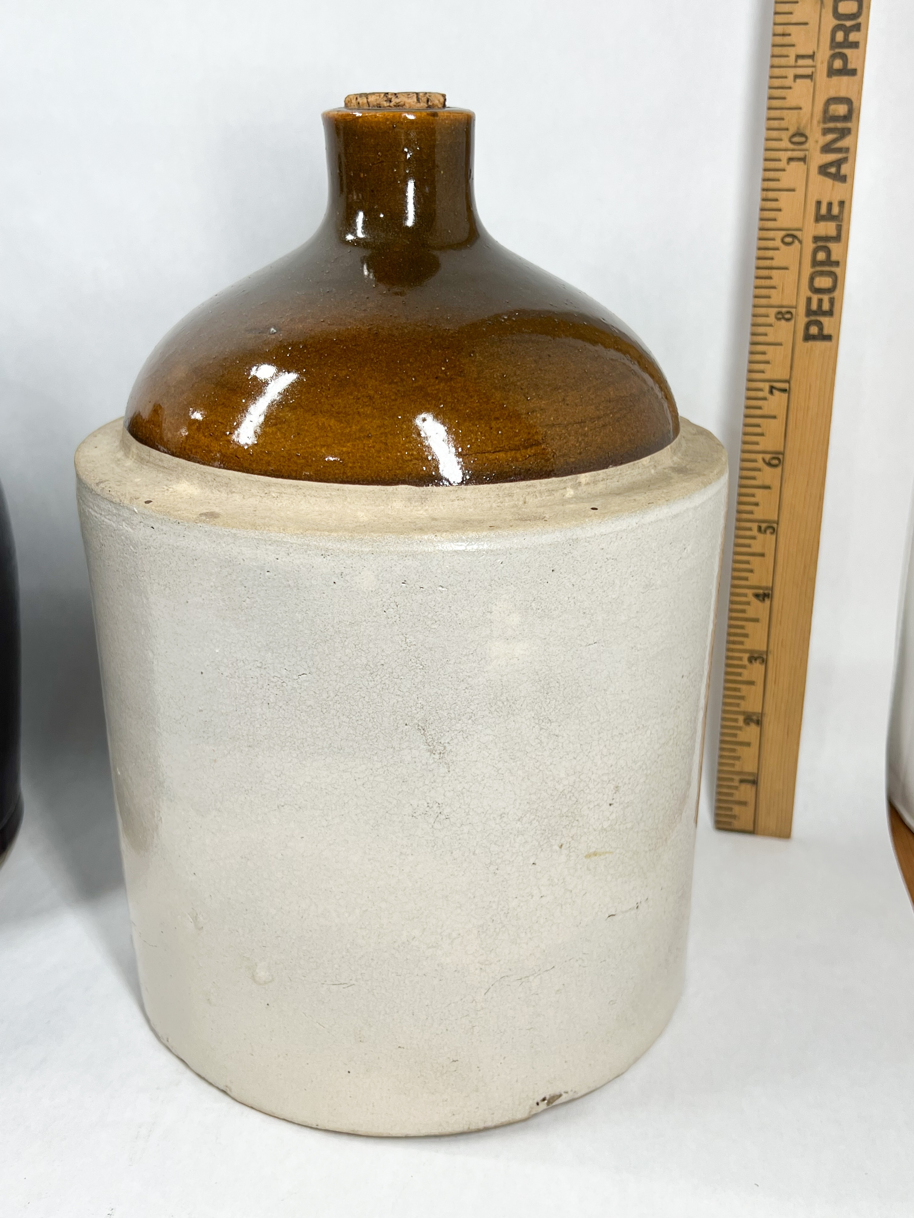 TWO ANTIQUE STONEWARE WHISKEY JUGS