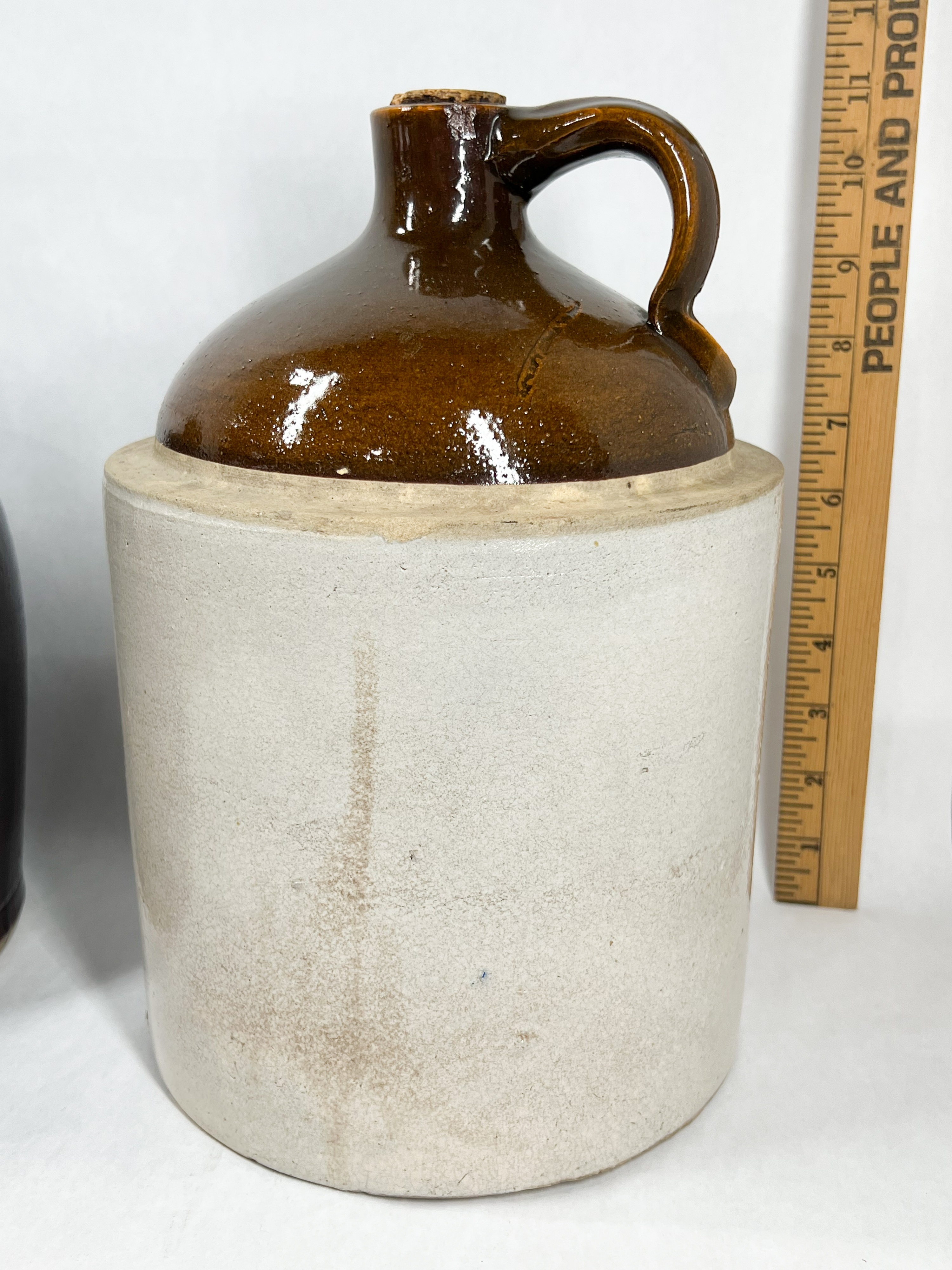 TWO ANTIQUE STONEWARE WHISKEY JUGS