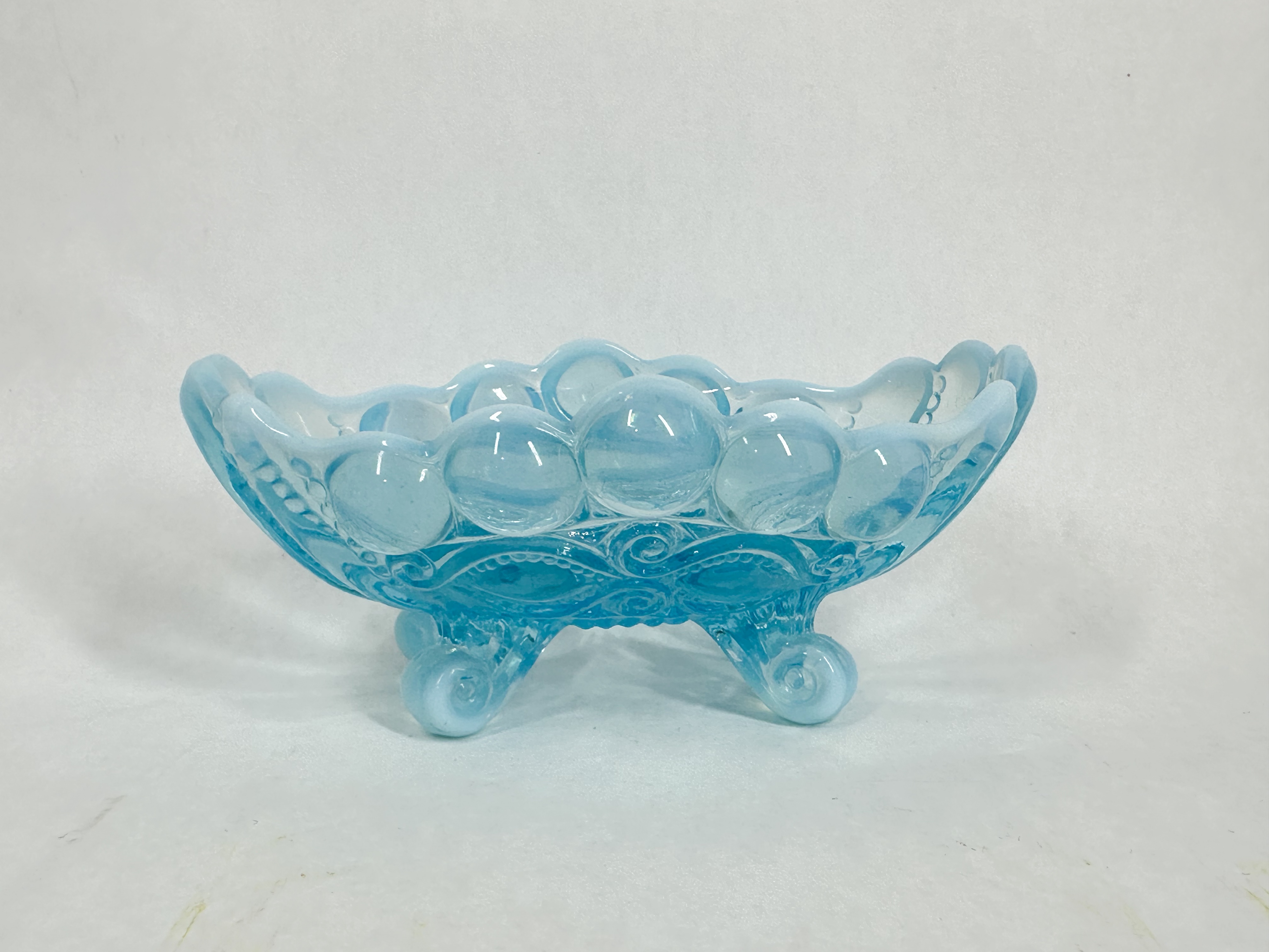 BLUE OPALESCENT EYE WINKER FOOTED BOWL