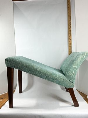 VINTAGE UPHOLSTERED SLOPING VANITY BENCH. Mahogany-stained hardwood vanity stool with a dramatic 