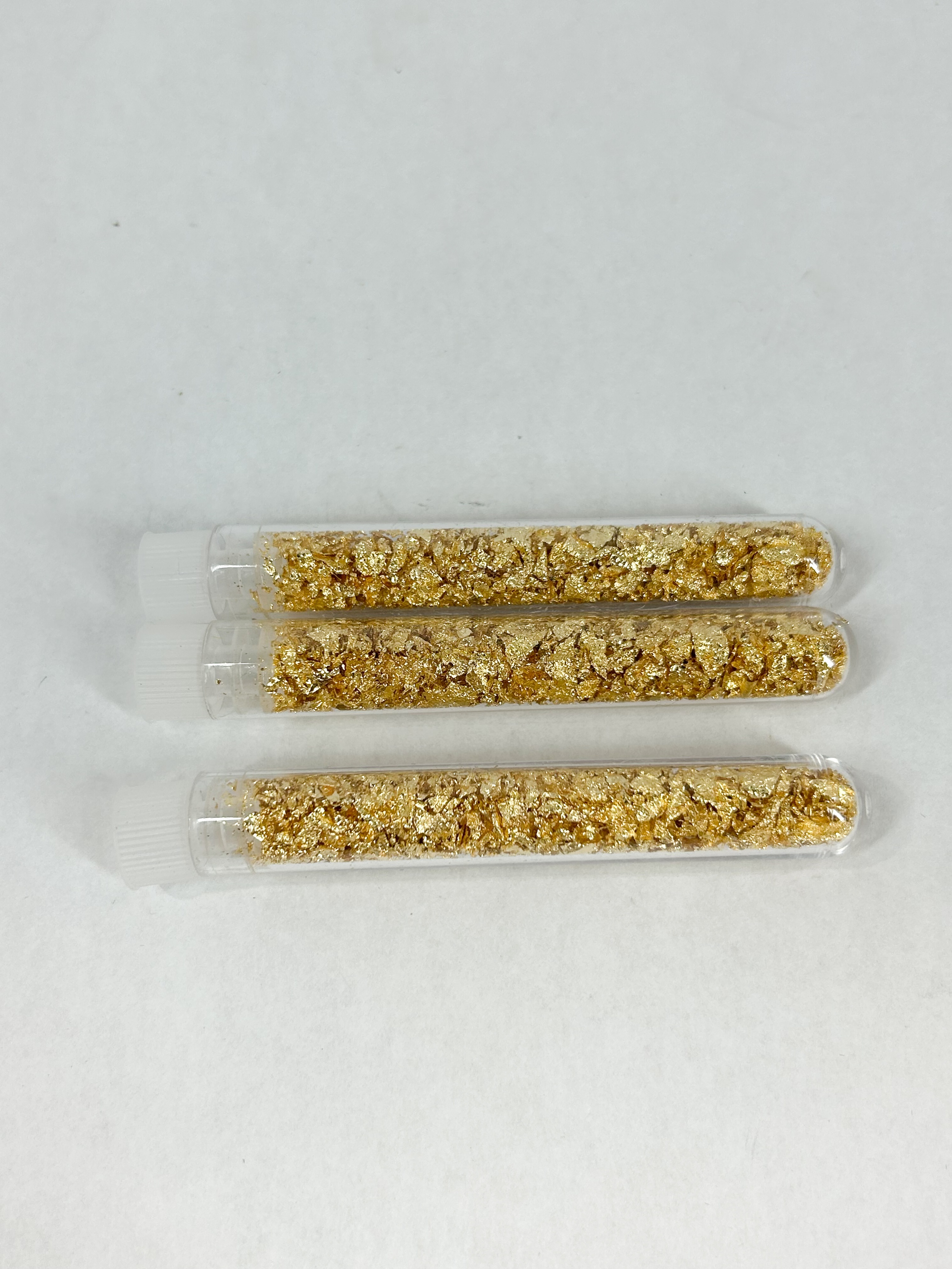 TRIO OF GOLD LEAF VIALS