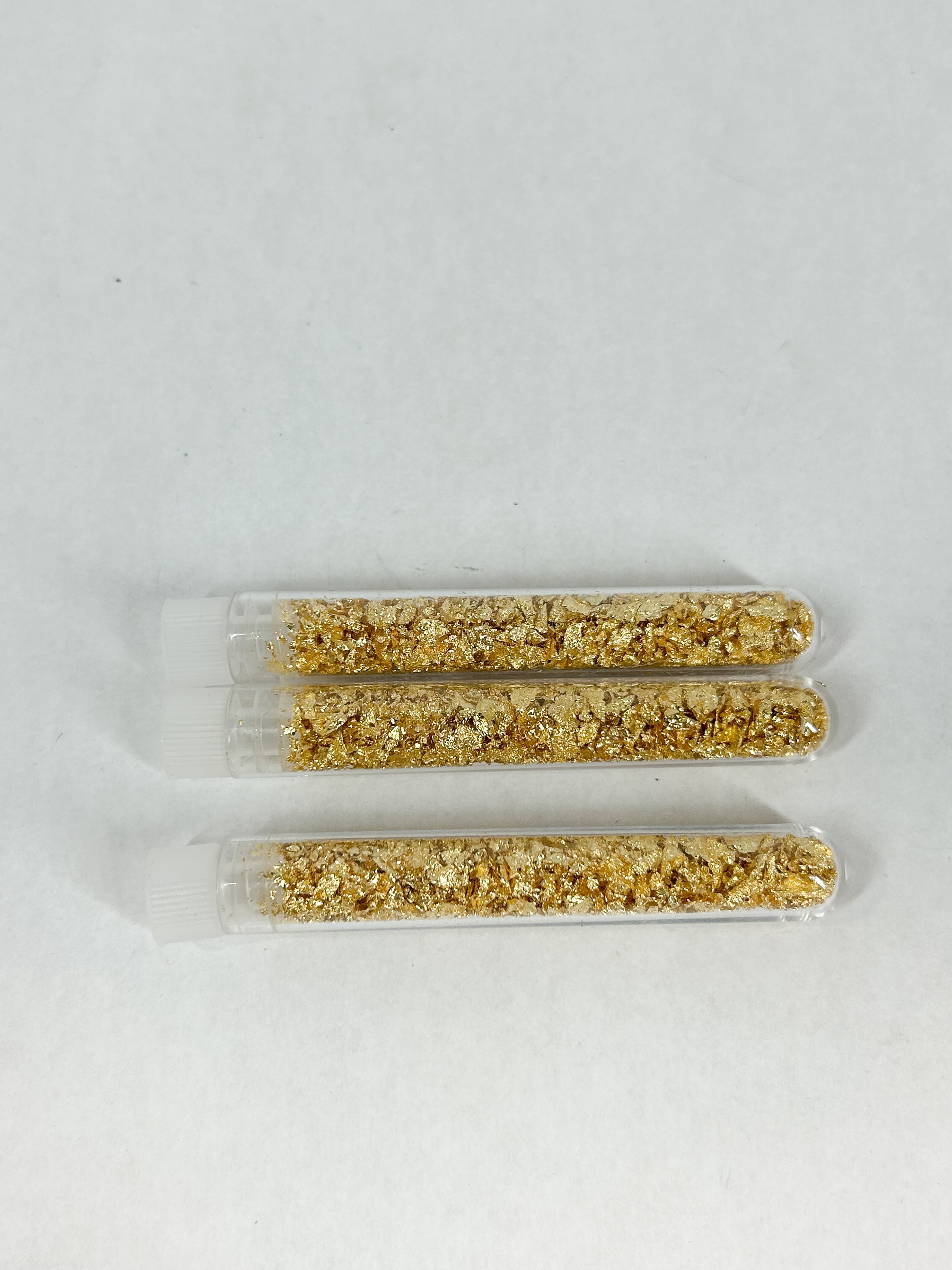 THREE GOLD LEAF FLAKES