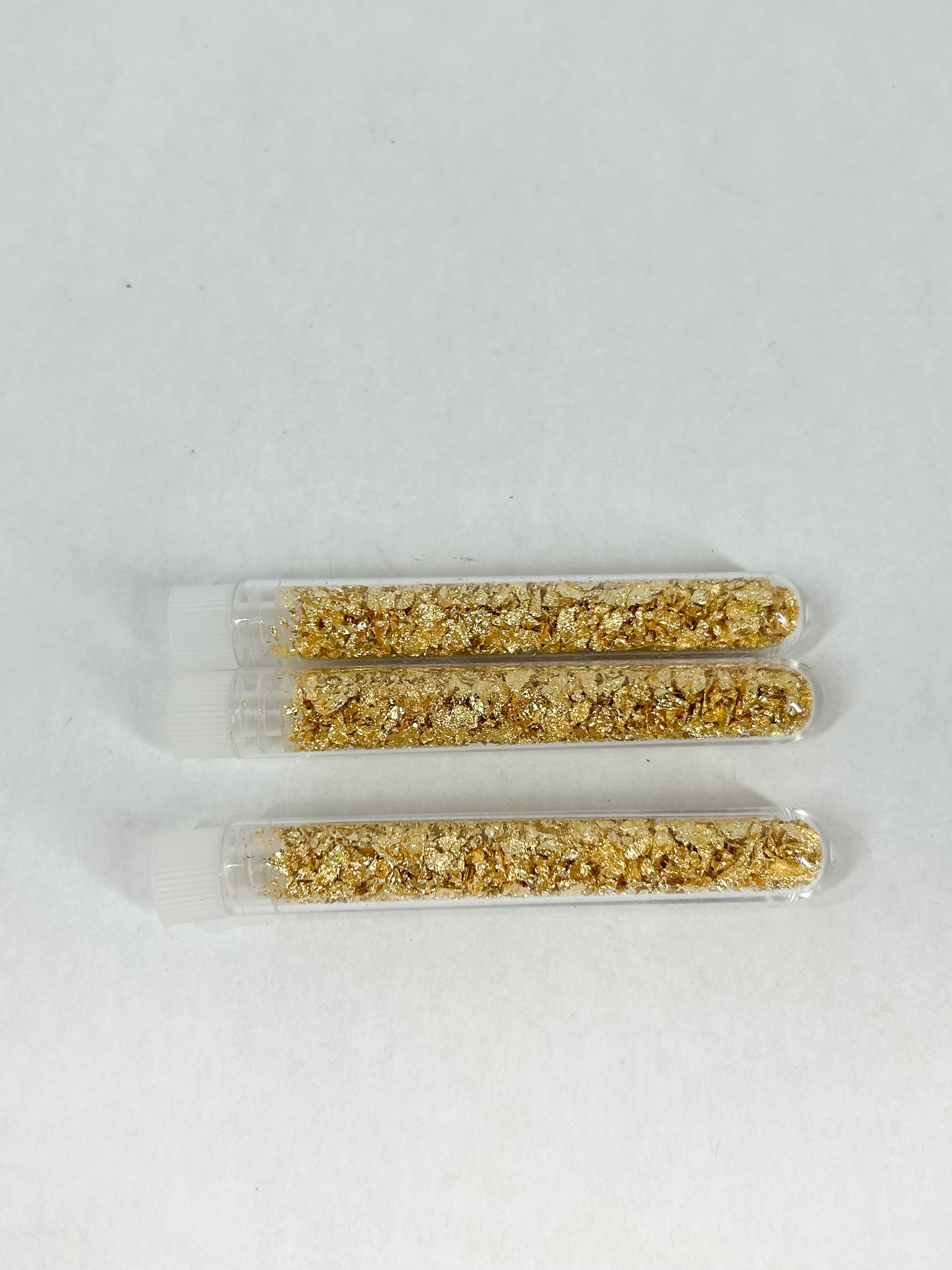 THREE GOLD LEAF FLAKES