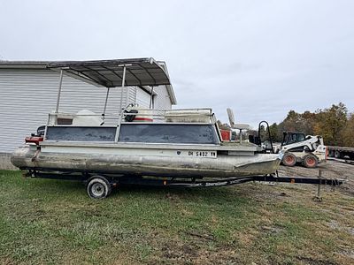 PONTOON BOAT, MOTOR & TRAILER. 50 EVINRUDE MOTOR, SHERELANDER TRAILER