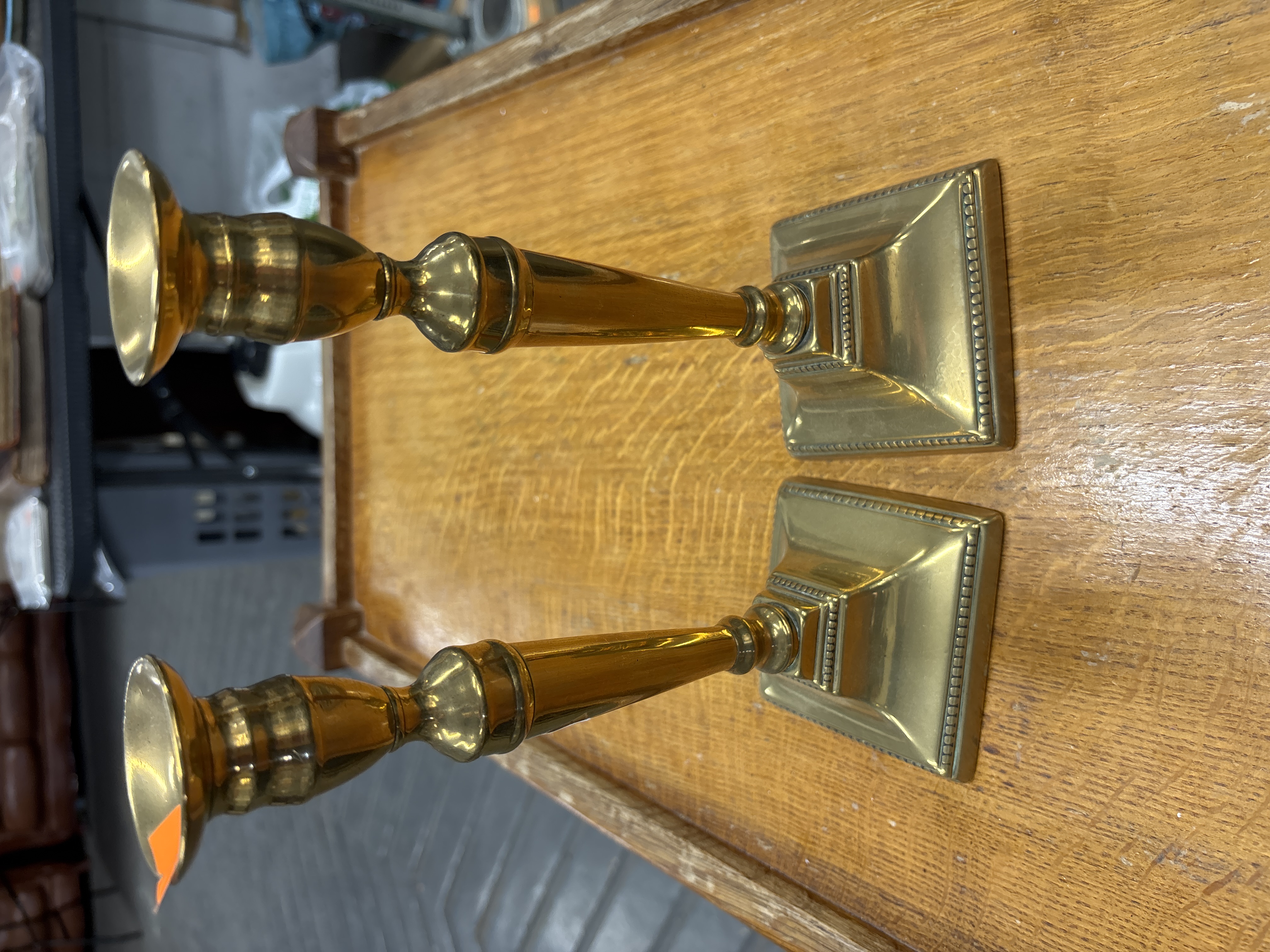 A Pair of Neoclassical Style Cast Brass Candlesticks