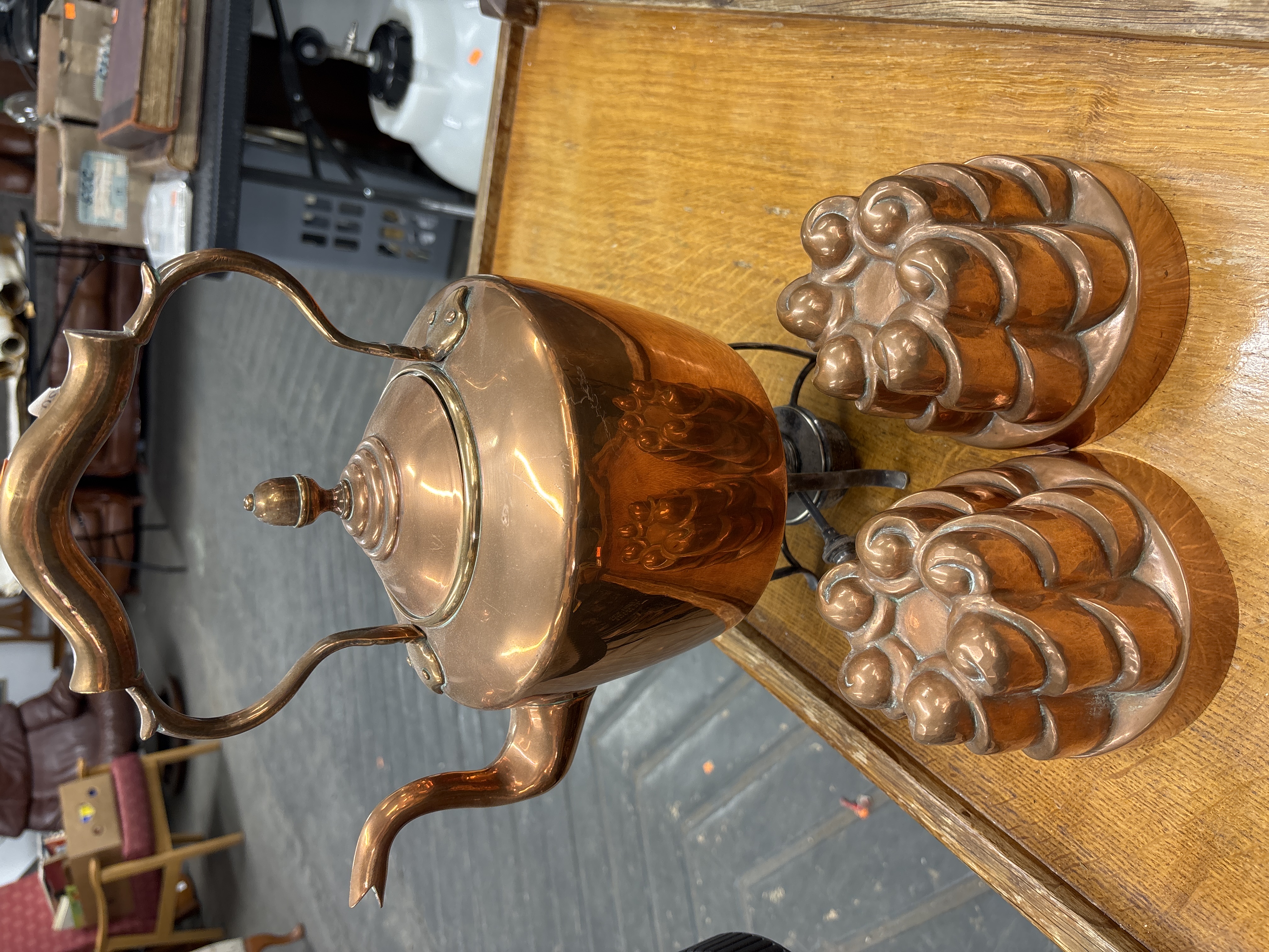 A Trio of Victorian Style Copper Kitchenware comprising a Spirit Kettle on Stand and Two Food Moulds