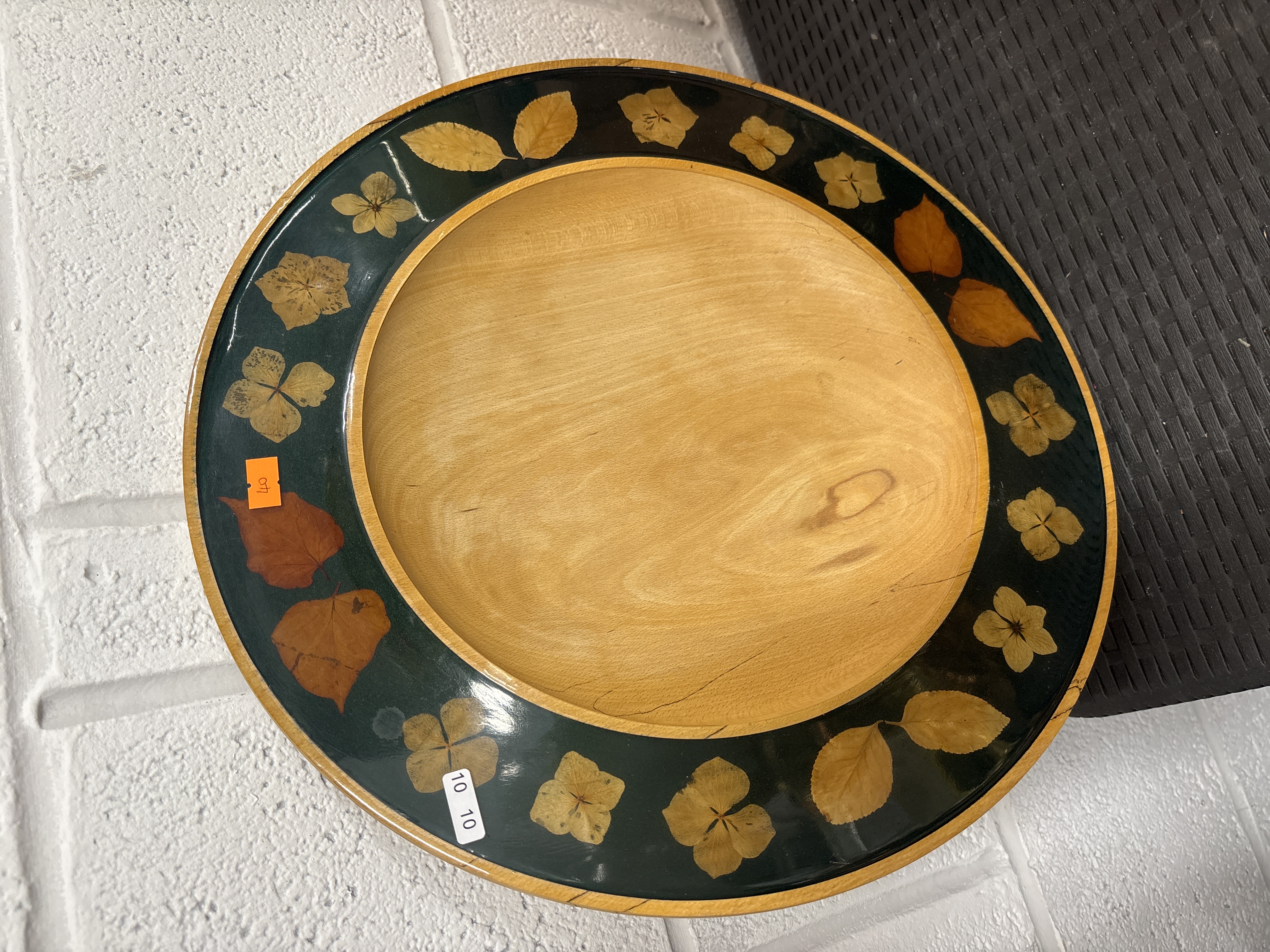 A Large Turned Wood Platter with Pressed Botanical Inlay Rim