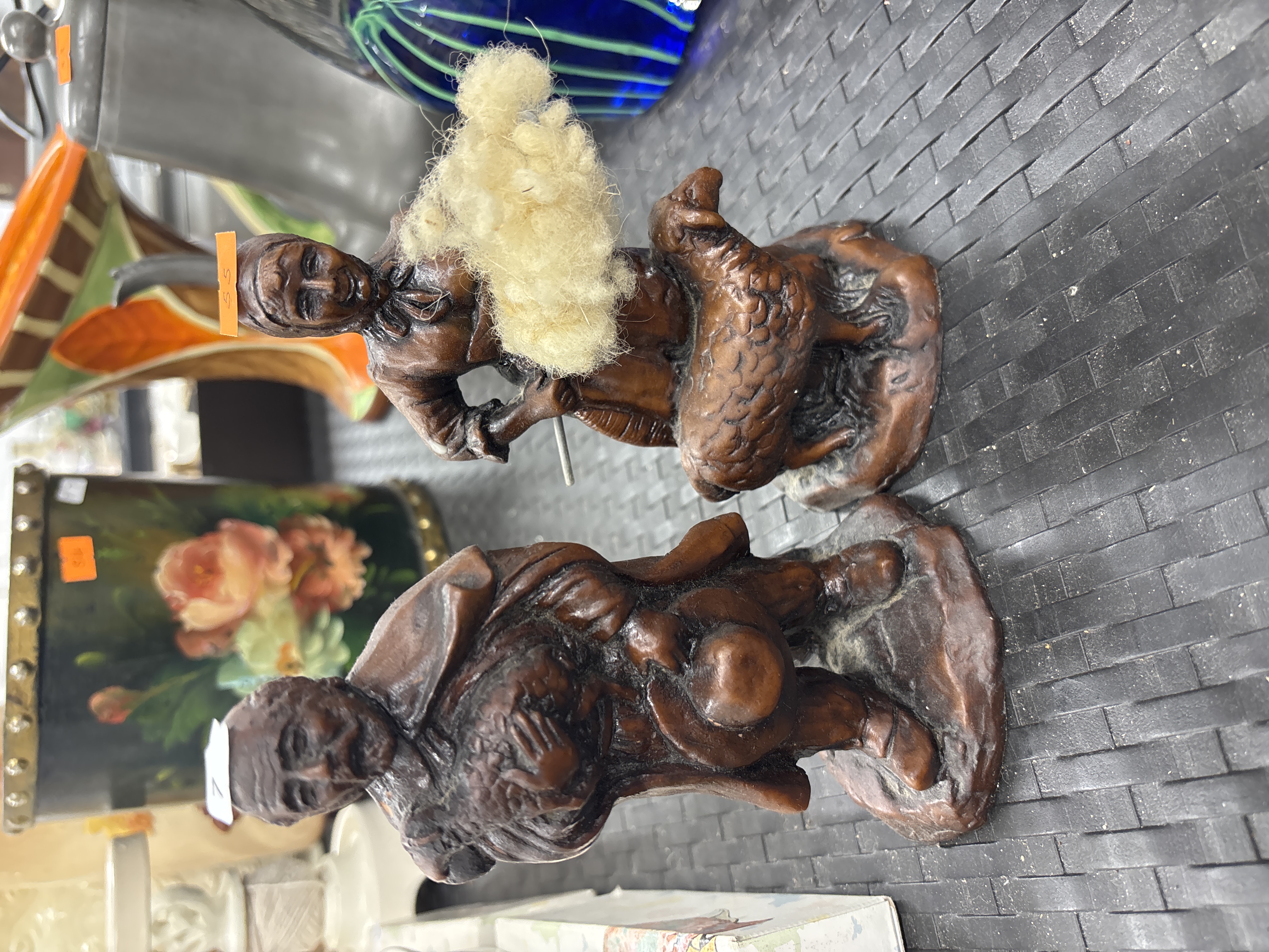 A Pair of Cast Resin Folk Art Style Figurines