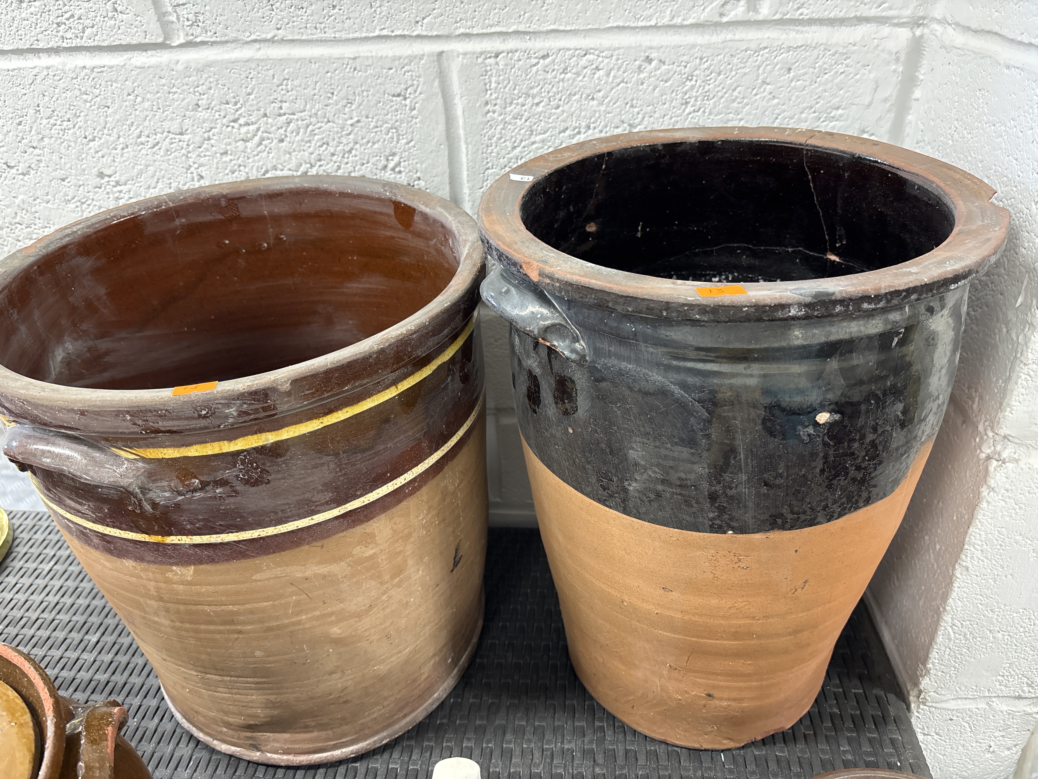 Two large glazed earthenware storage crocks