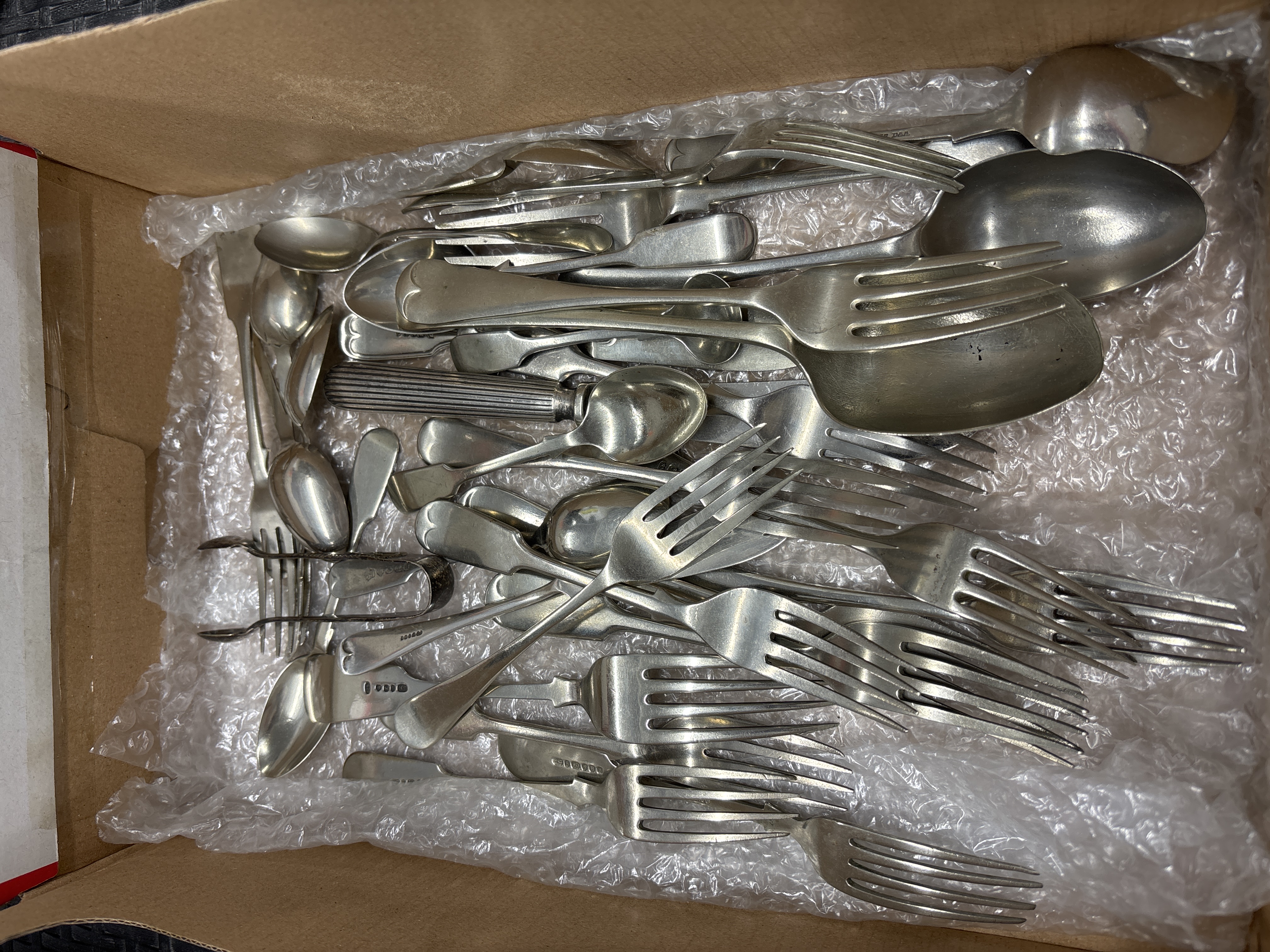 An Assortment of British Sterling Silver and Silver-Plated Flatware
