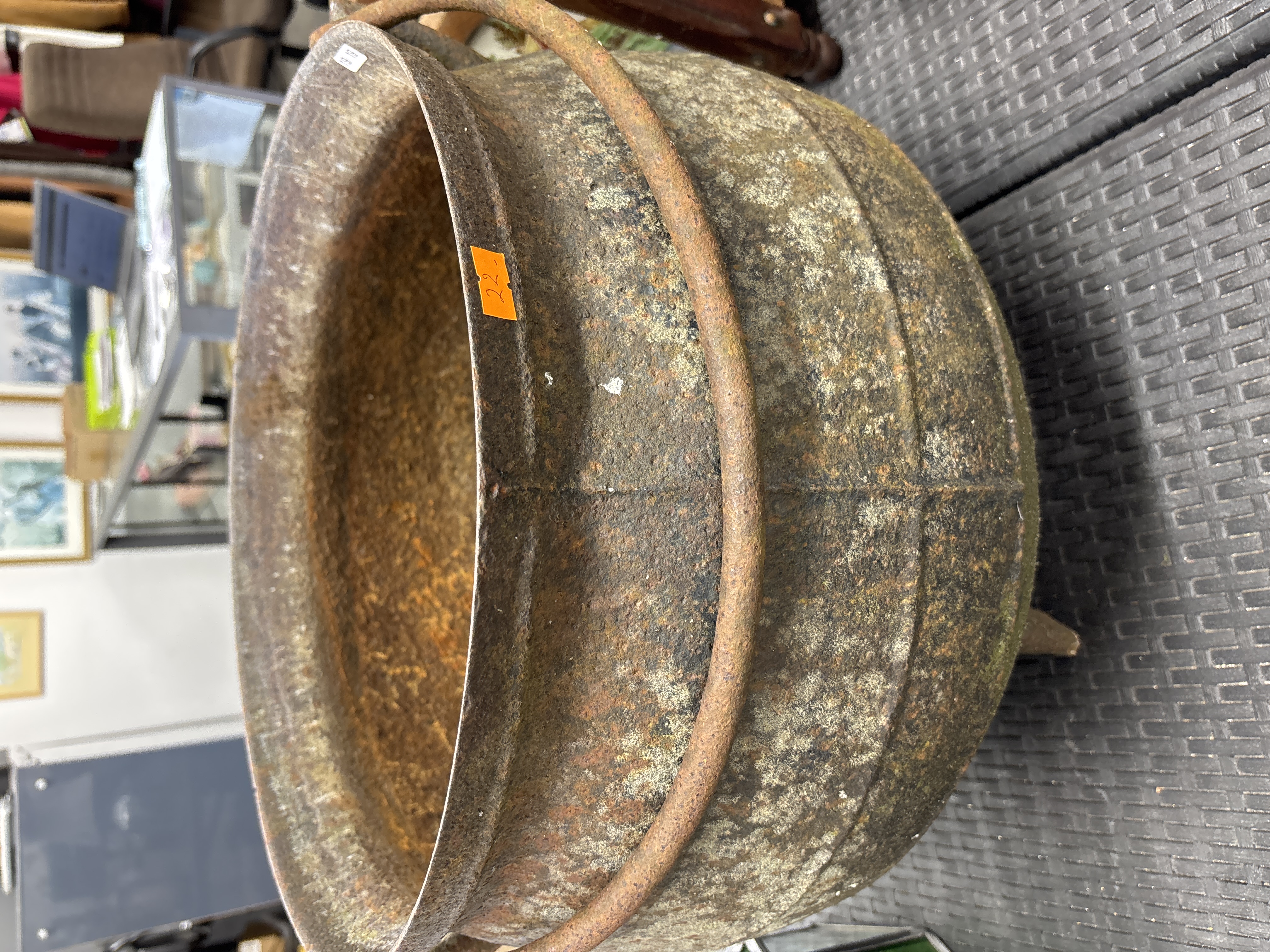 Large cast iron three-legged cauldron with bail handle