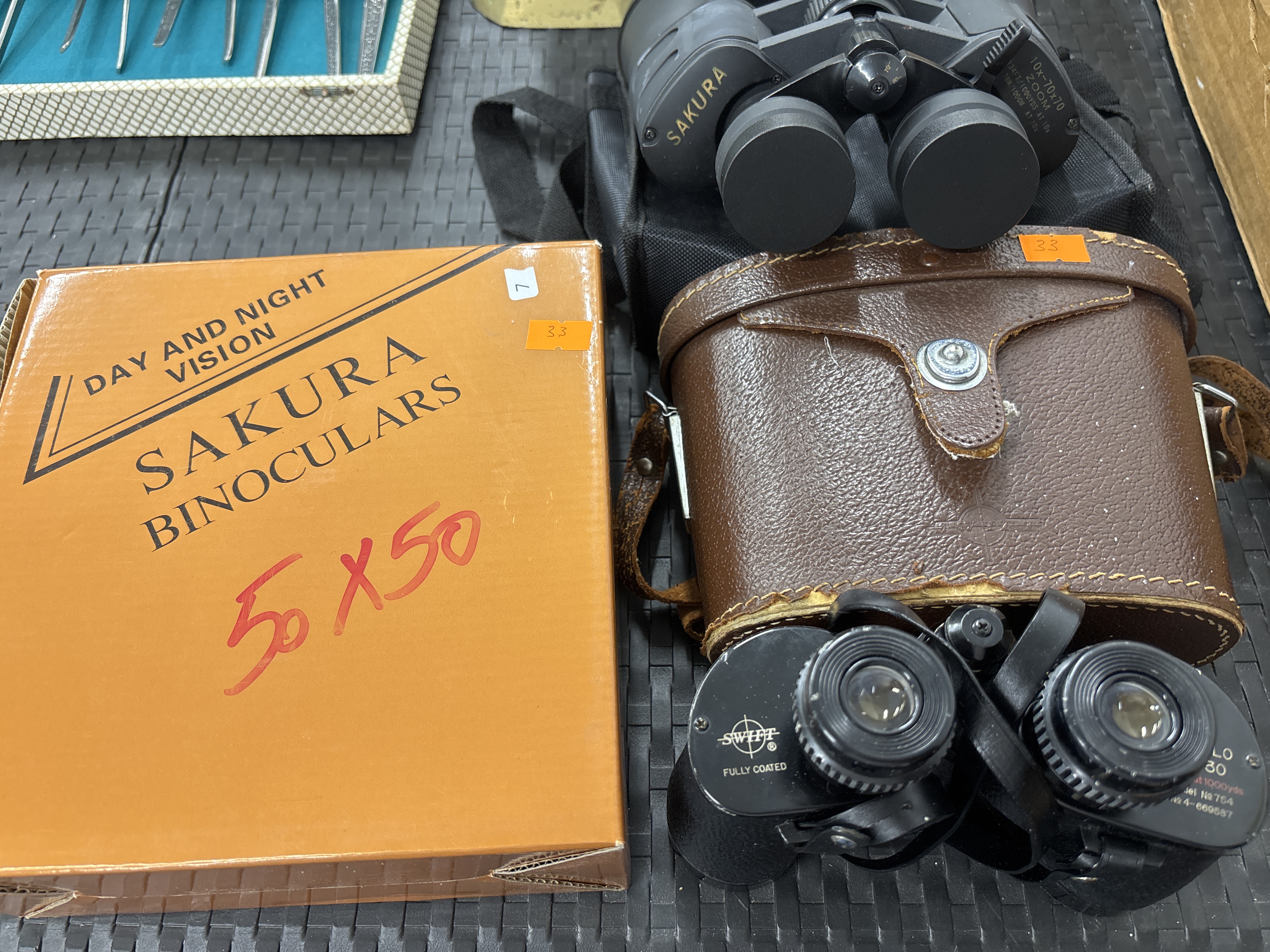 Two Pairs of Binoculars by Swift and Sakura with Cases