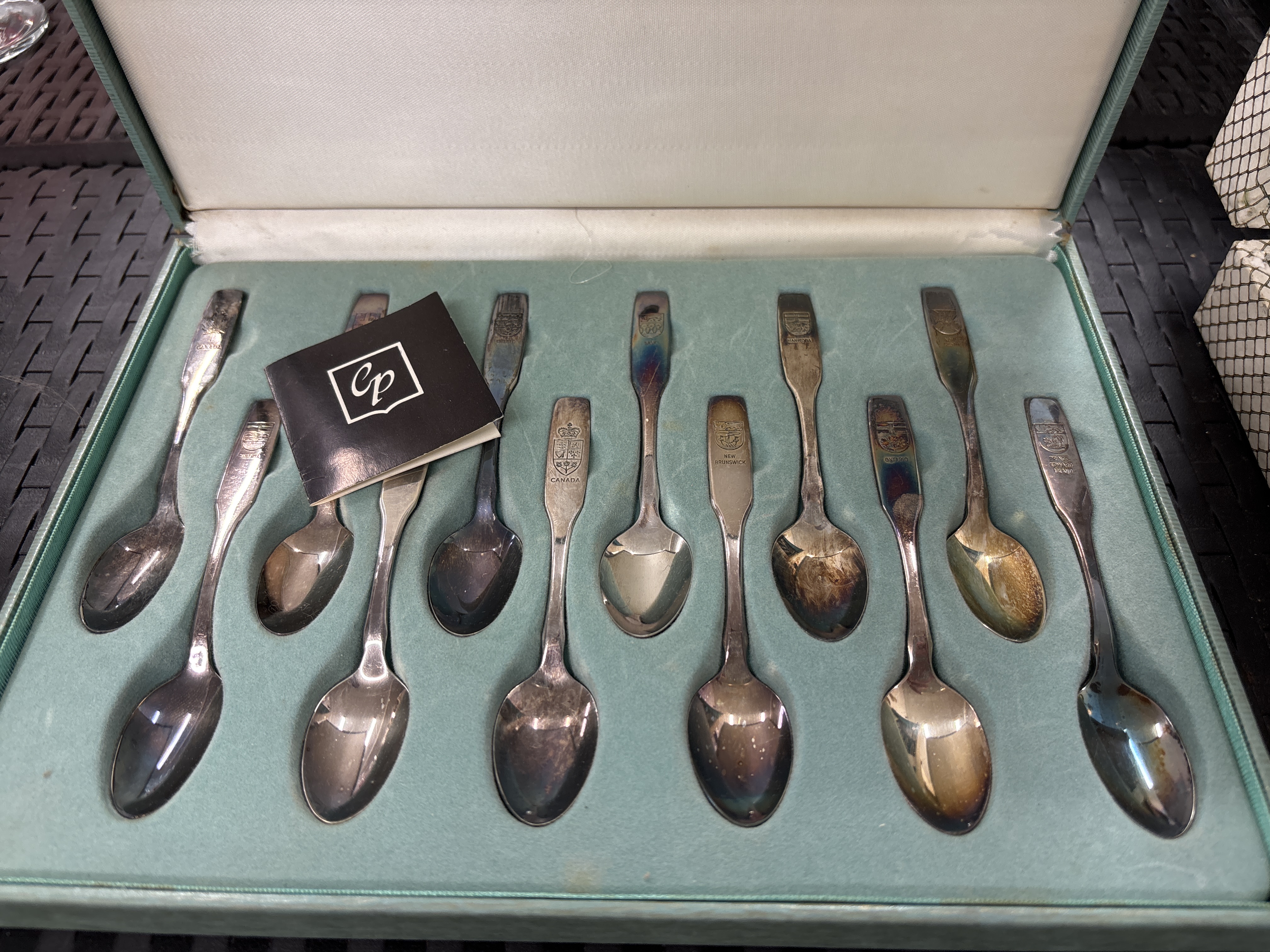 A Set of Twelve Canadian Pacific Silver-Plated Souvenir Spoons