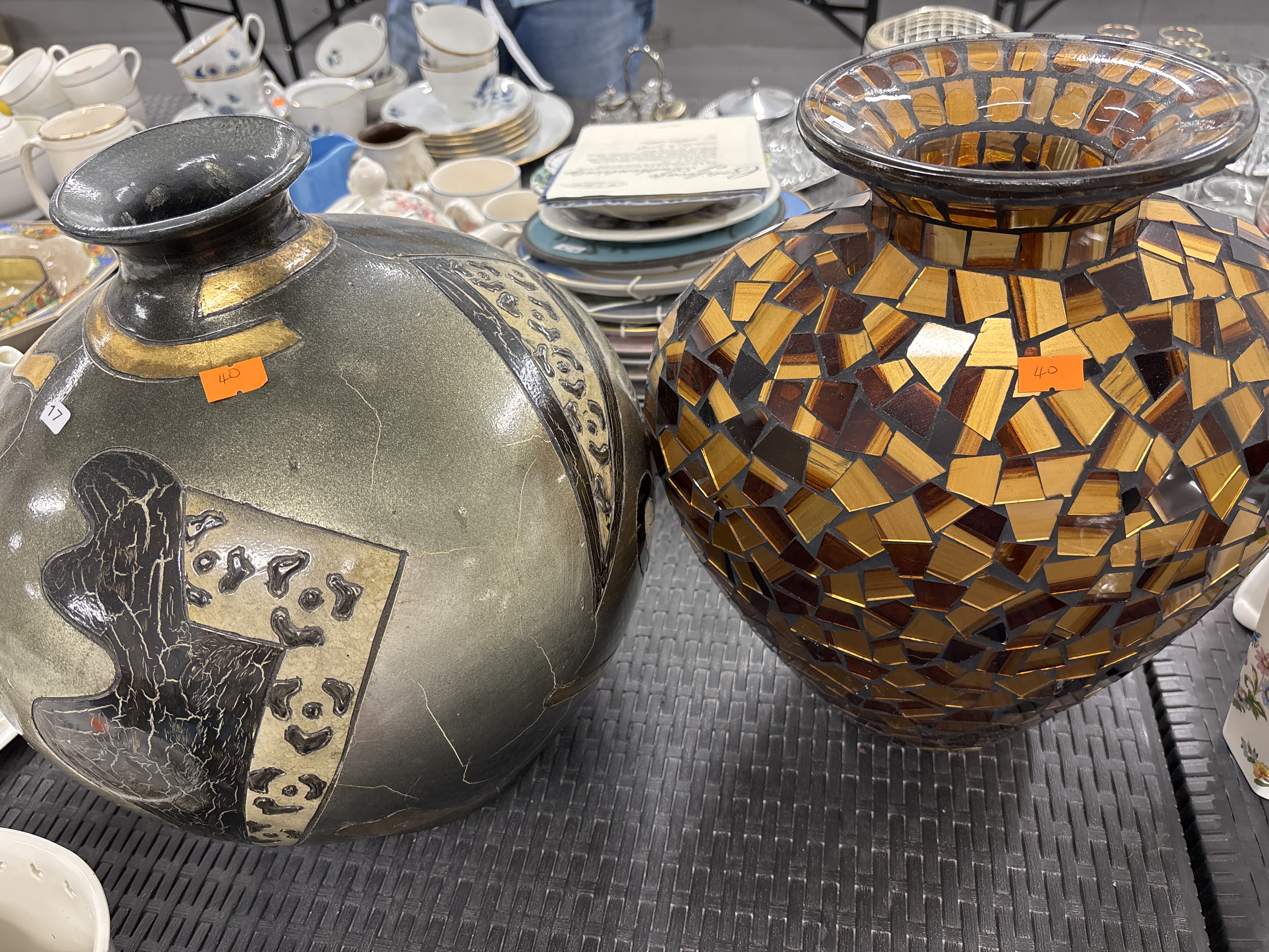 Two large decorative vases comprising one glazed earthenware vessel and one glass mosaic vessel