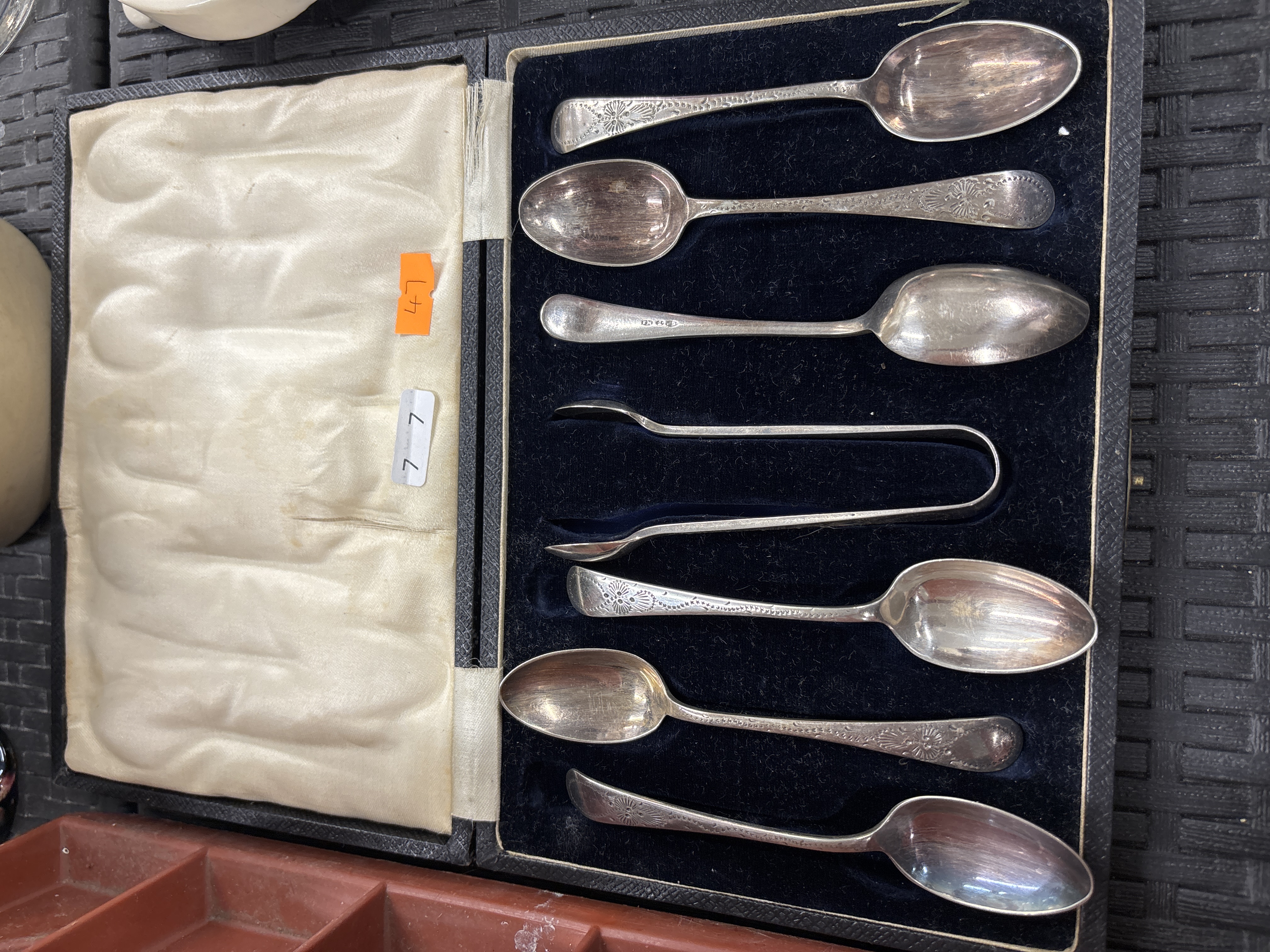 A Cased Set of Six Silver-Plated Teaspoons and a Pair of Sugar Tongs